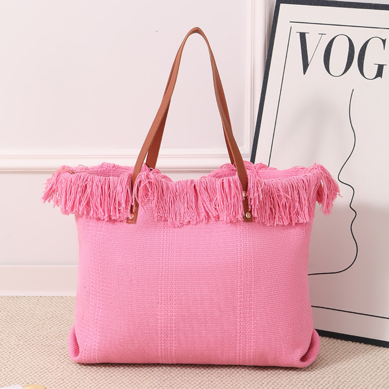 Summer new women's shoulder bag, new tassel handbag, large capacity simple handheld shoulder canvas bag, commuting woven beach bag, new women