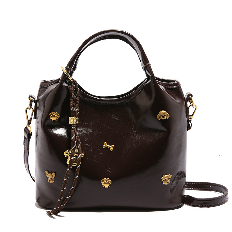 2025 Summer new women's crossbody bag, puppy rivet luxury niche new women's fashion bucket bag, retro women's shoulder bag, new designe