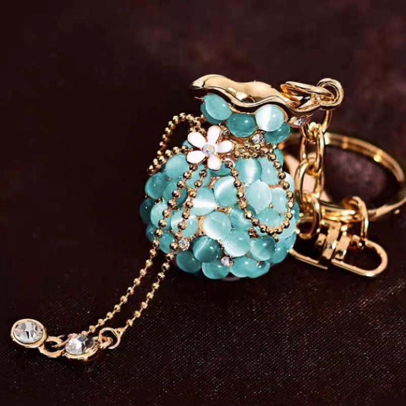 Money Bag Cat's Eye Stone Tassel Rhinestone Version Korean Women's Creative Crystal Car Keychain Key Ring Hanging Car accessories