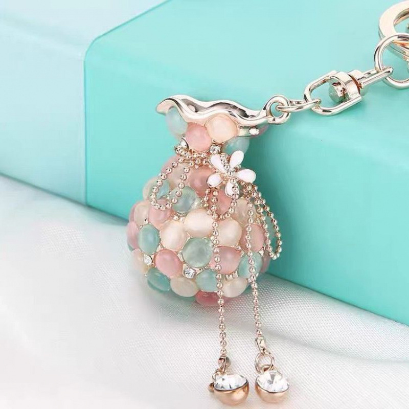 Money Bag Cat's Eye Stone Tassel Rhinestone Version Korean Women's Creative Crystal Car Keychain Key Ring Hanging Car accessories