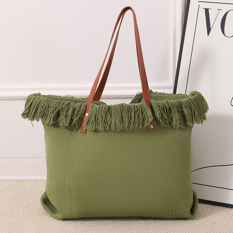 Summer new women's shoulder bag, new tassel handbag, large capacity simple handheld shoulder canvas bag, commuting woven beach bag, new women