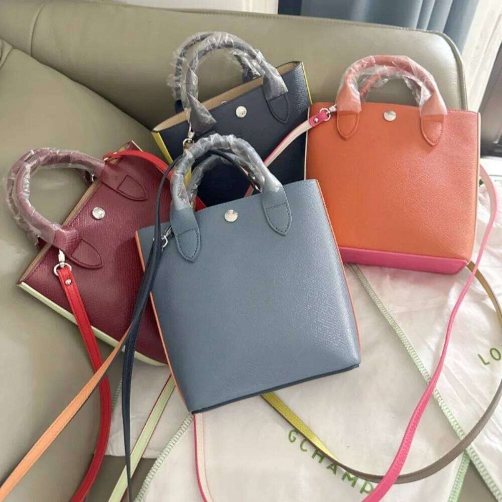 high-quality new cowhide mini tote bag, color blocking and contrasting handbag, hand-held bucket, women's bag