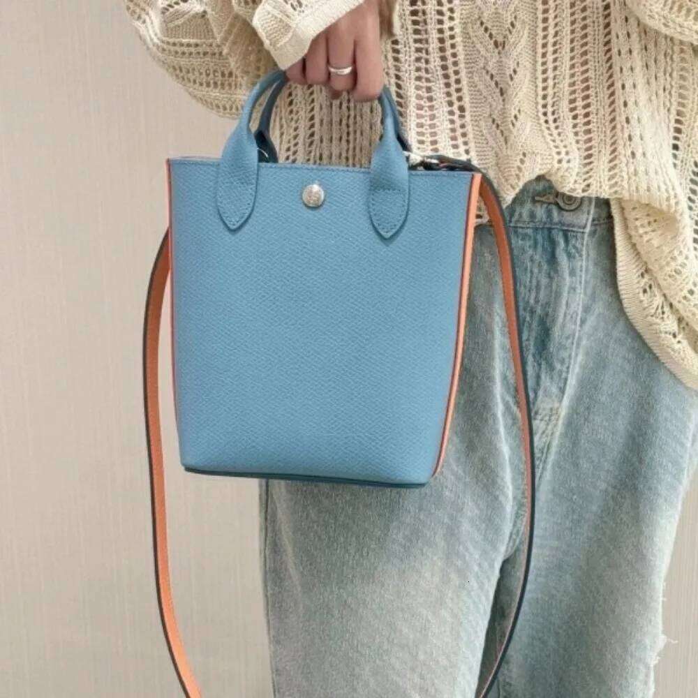 high-quality new cowhide mini tote bag, color blocking and contrasting handbag, hand-held bucket, women's bag