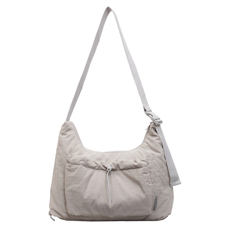 2025 nylon messenger bag, designer unisex style, lightweight and large capacity, casual backpack, multi-functional commuter bag, dumpling bag