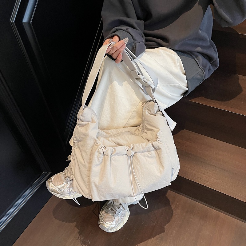 2025 nylon messenger bag, designer unisex style, lightweight and large capacity, casual backpack, multi-functional commuter bag, dumpling bag