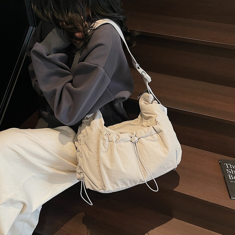 2025 nylon messenger bag, designer unisex style, lightweight and large capacity, casual backpack, multi-functional commuter bag, dumpling bag