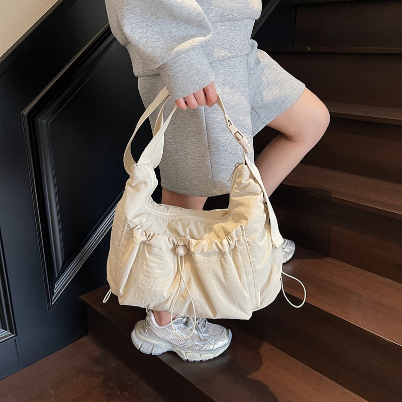 2025 nylon messenger bag, designer unisex style, lightweight and large capacity, casual backpack, multi-functional commuter bag, dumpling bag