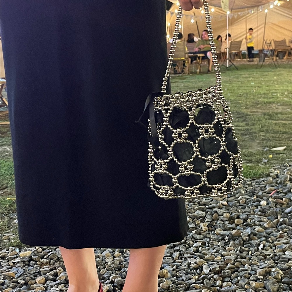 2025 Summer new women's shoulder bag new fashion niche solid women's color handmade retro small round bead hollow weave women's handbag