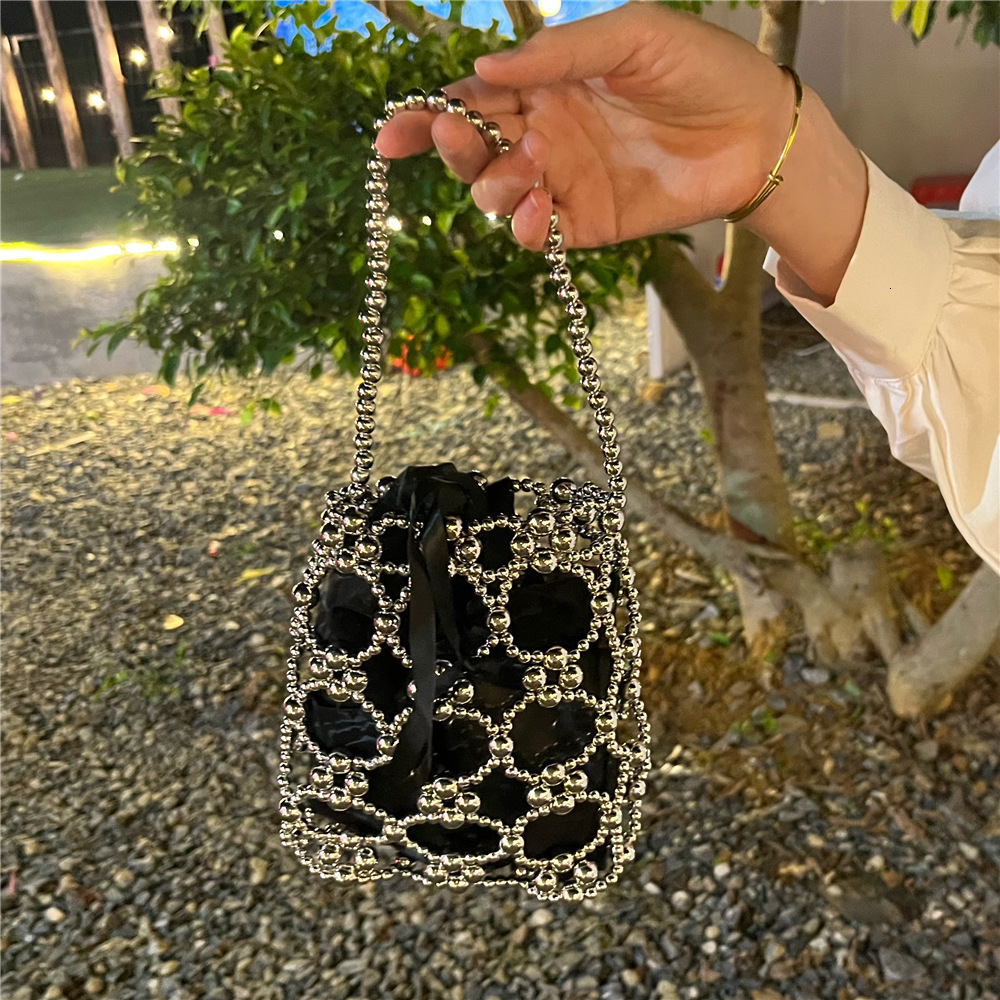 2025 Summer new women's shoulder bag new fashion niche solid women's color handmade retro small round bead hollow weave women's handbag