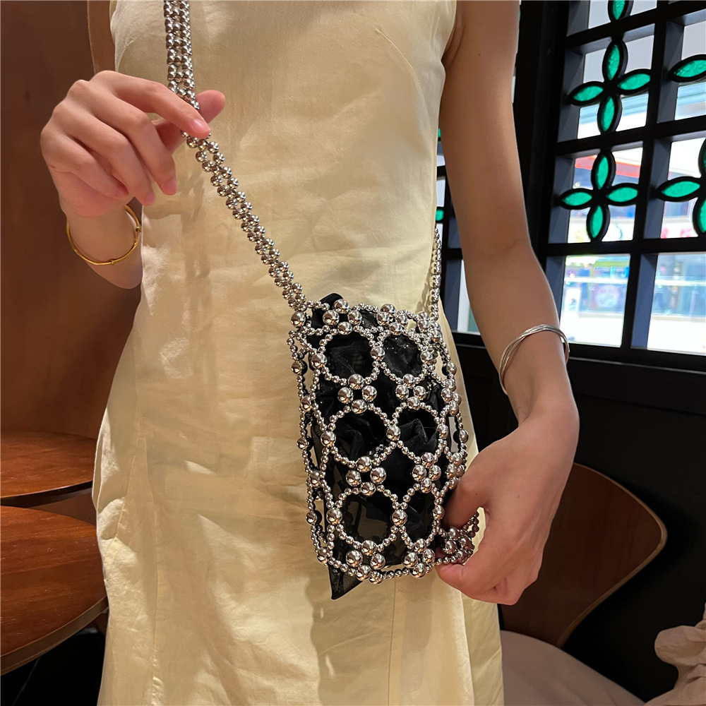2025 Summer new women's shoulder bag new fashion niche solid women's color handmade retro small round bead hollow weave women's handbag