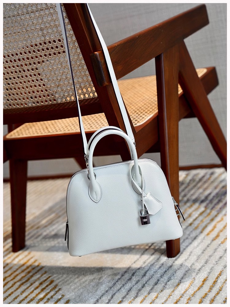 High-quality designer crossbody bag - handmade pure leather handbag. Small high-end bowling bag made of leather for women's crossbody bag.