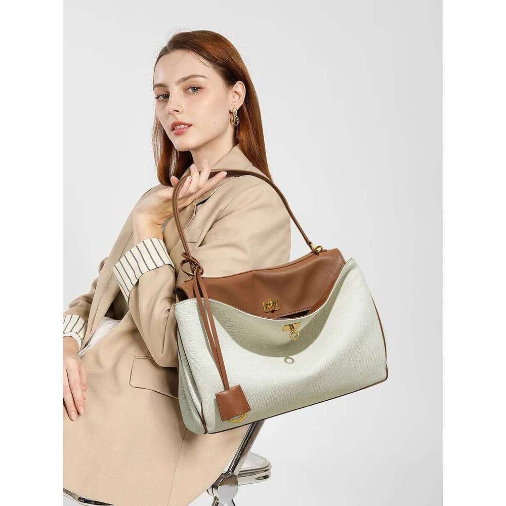 High-End Rodeobag Canvas Cowhide Women's Tote Bag Large Capacity Niche Armpit Design for Commuting Stylish And Practical
