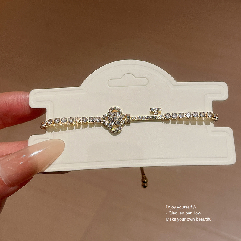 Gold Tone Key Shaped Slider Bracelet Pave Crystal Accents Elegant Party Jewelry And Daily Wear Gift For Her High Quality And Stylish Jewelry