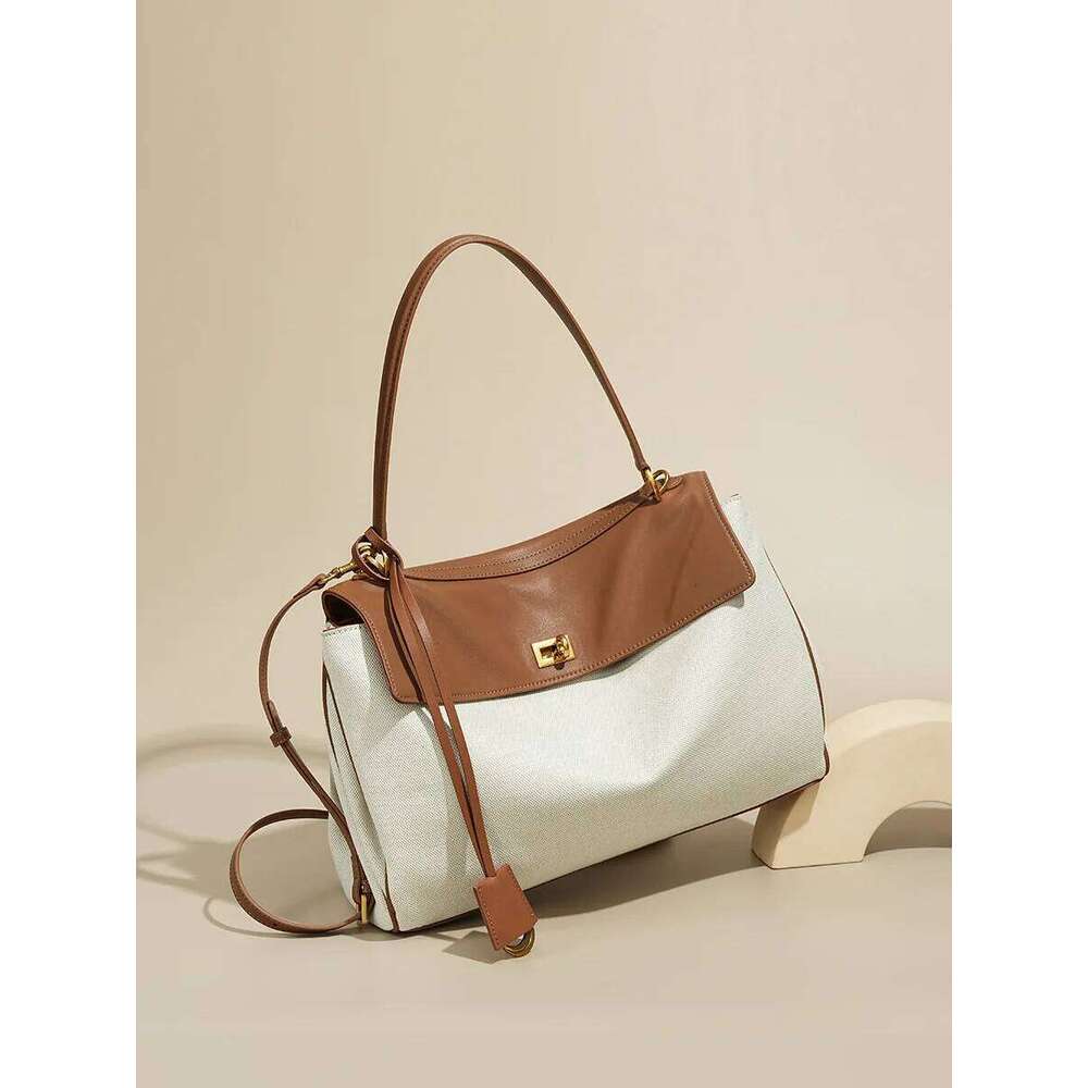 High-End Rodeobag Canvas Cowhide Women's Tote Bag Large Capacity Niche Armpit Design for Commuting Stylish And Practical