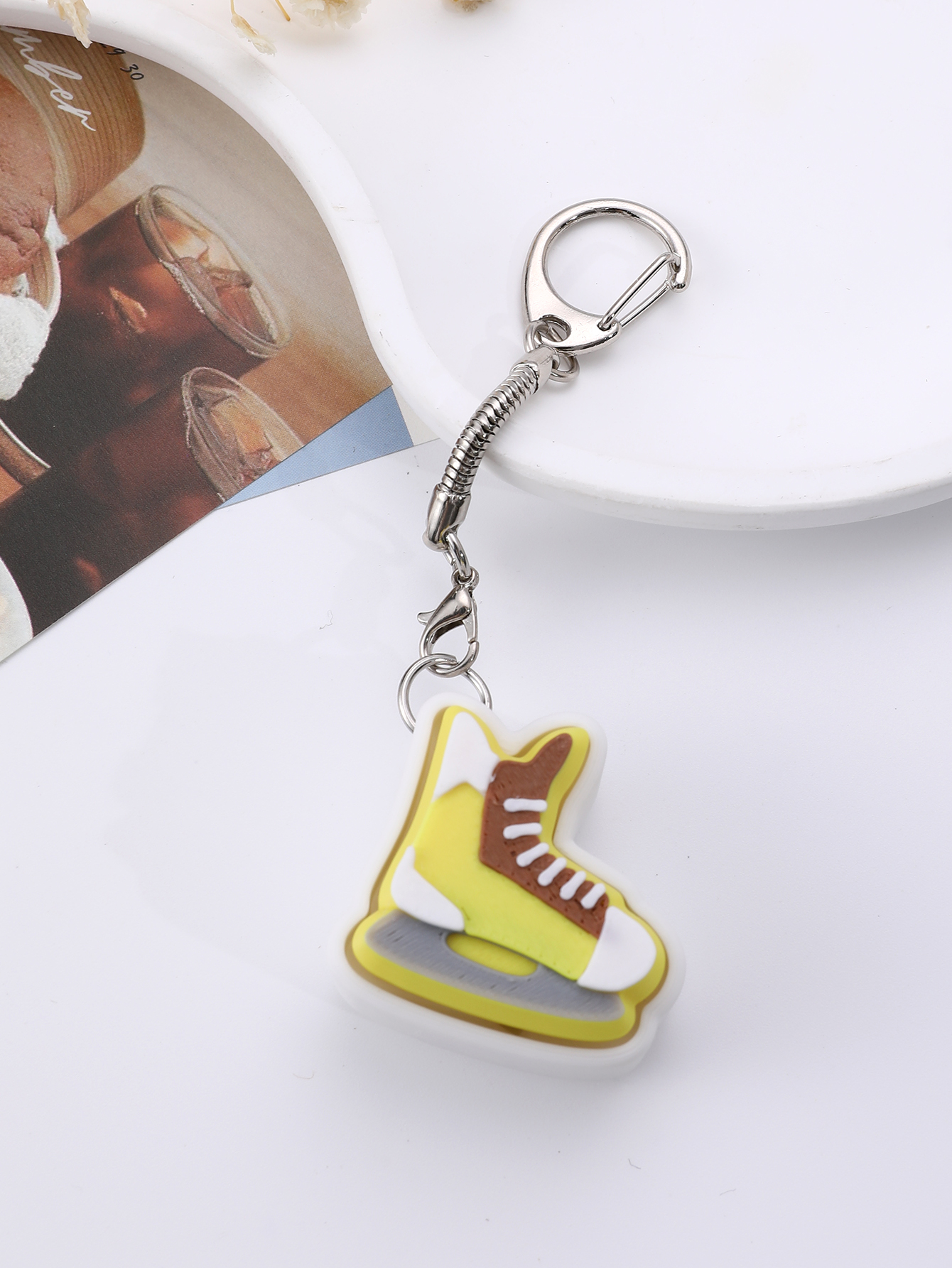 3D printed skating shoe-shaped keychain - an adult stress relief toy with a portable anxiety-reducing gadget featuring a clickable keyboard design