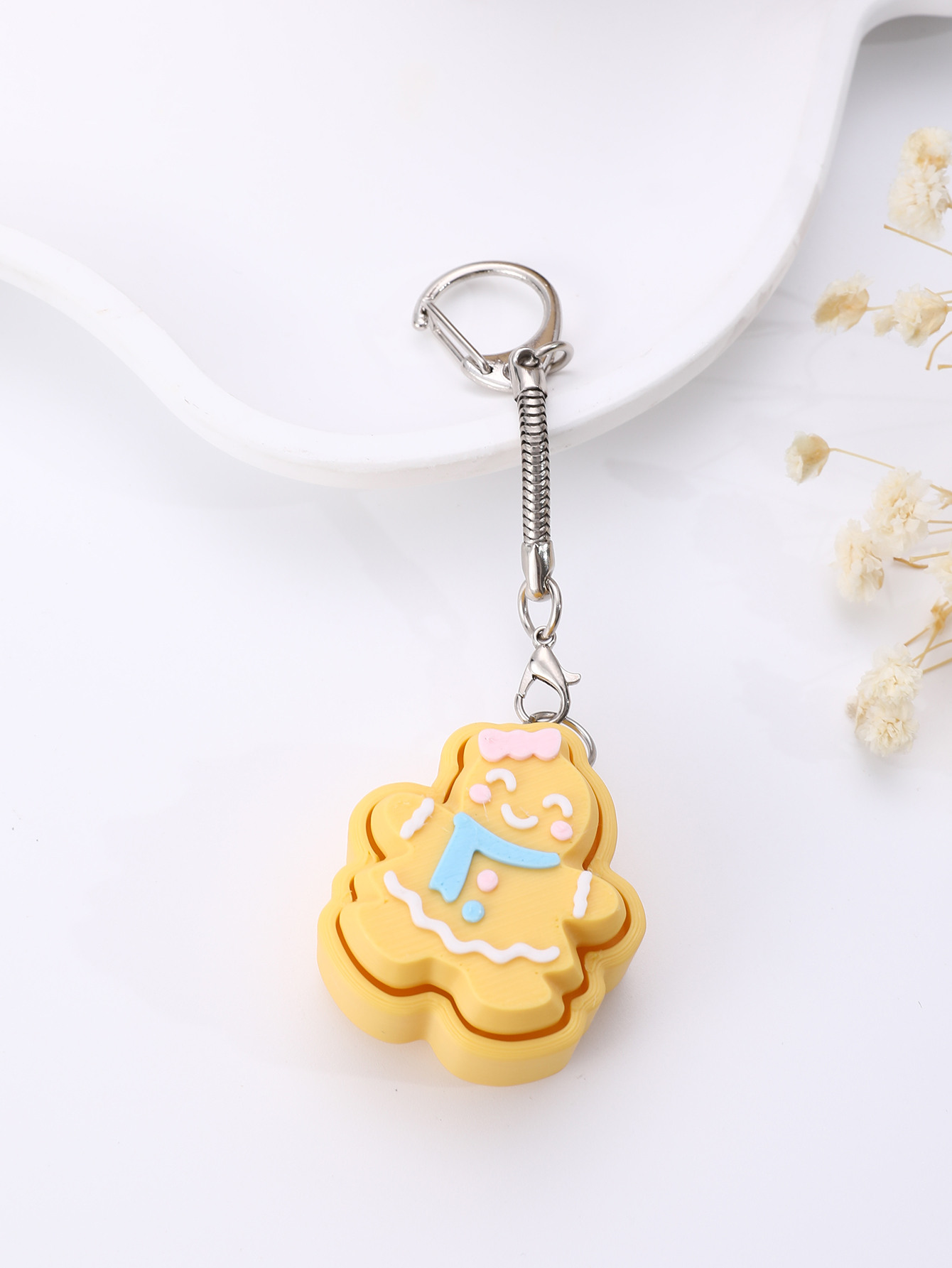 3D printed cookie-shaped keychain - an adult stress relief toy with a portable anxiety relief gadget featuring a clickable keyboard design