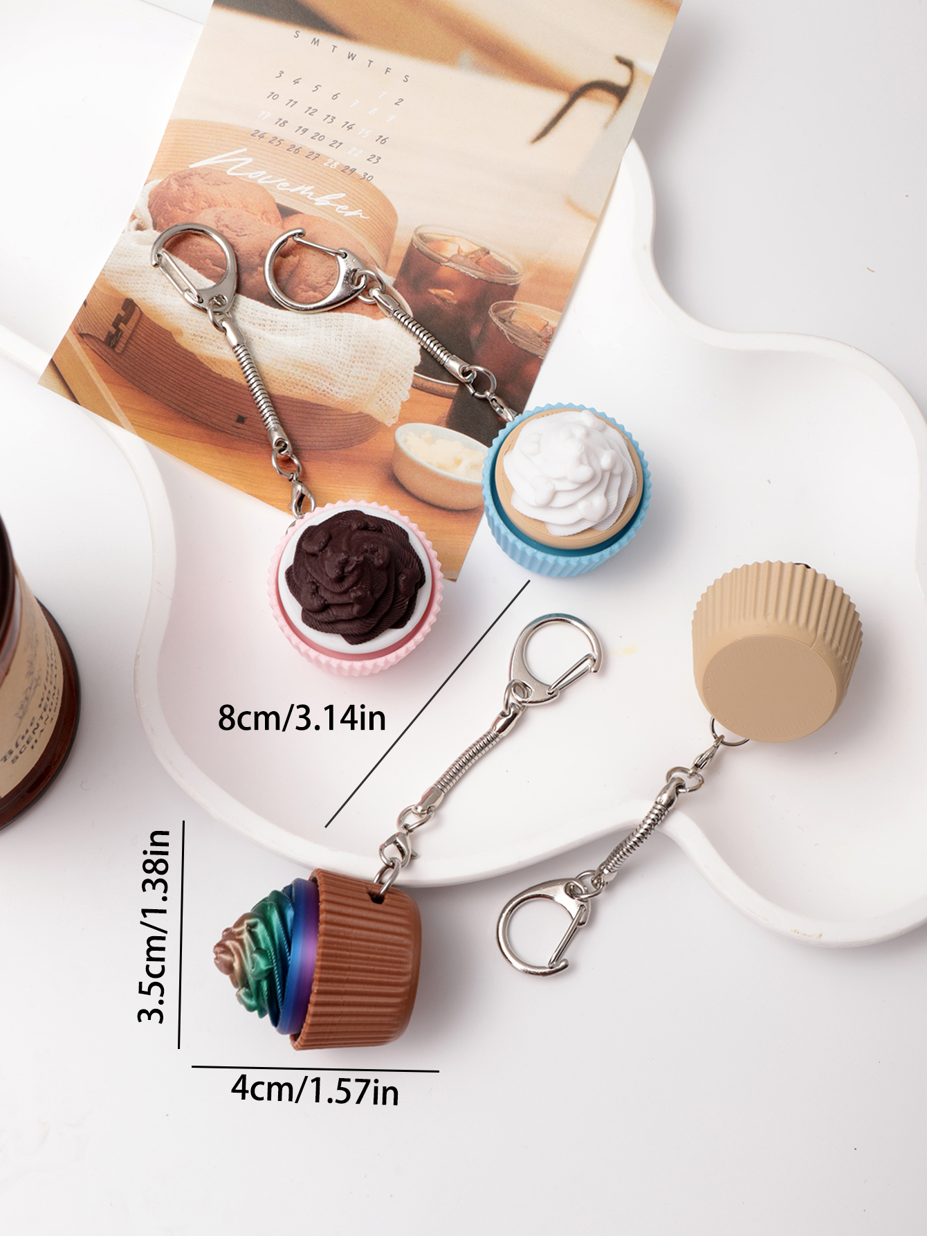 3D printed cupcake-shaped keychain - an adult stress relief toy with a portable anxiety-reducing gadget featuring a clickable keyboard design