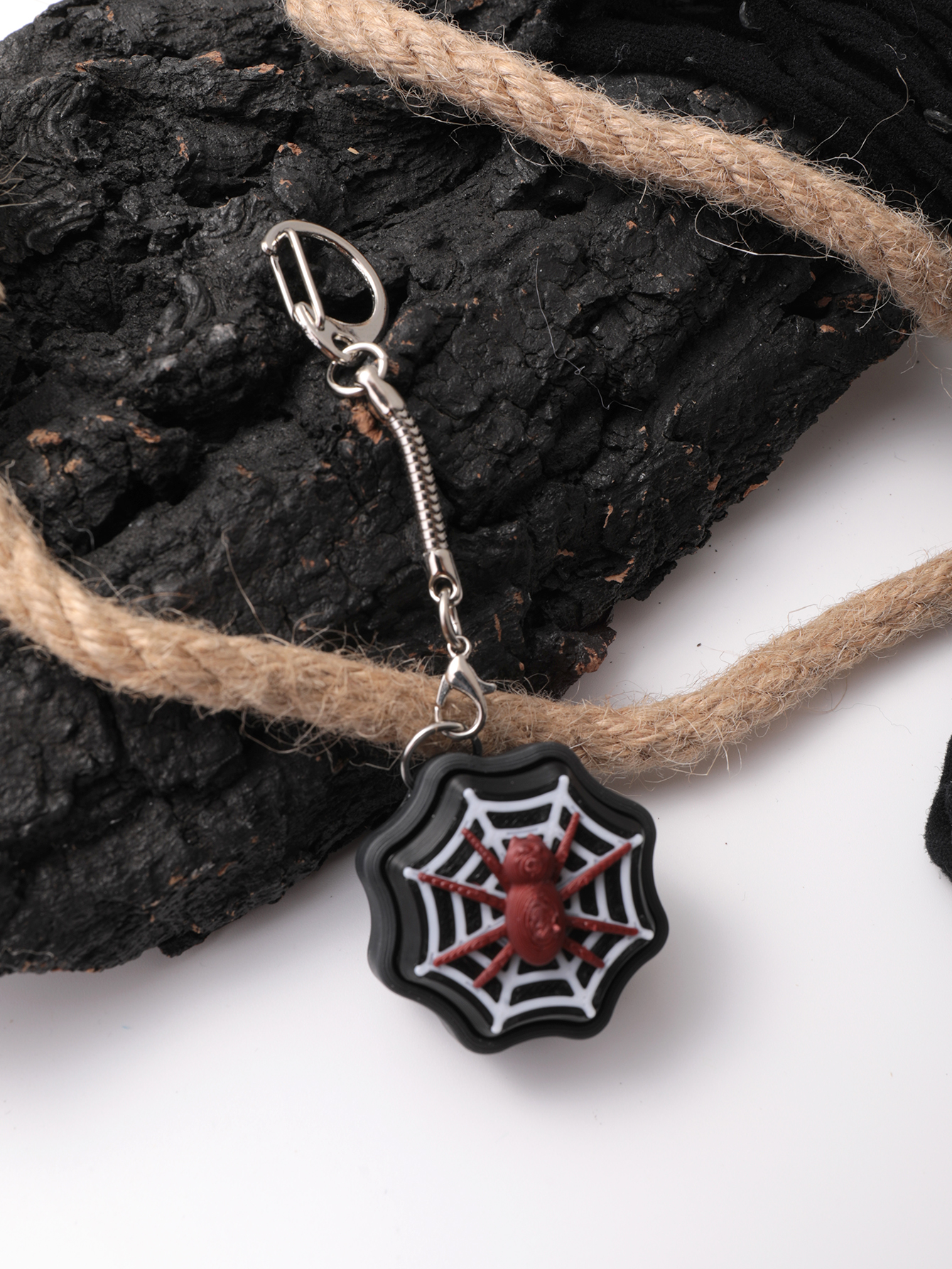 3D printed spider keychain - an adult stress relief toy with a portable anxiety-reducing gadget featuring a clickable keyboard design