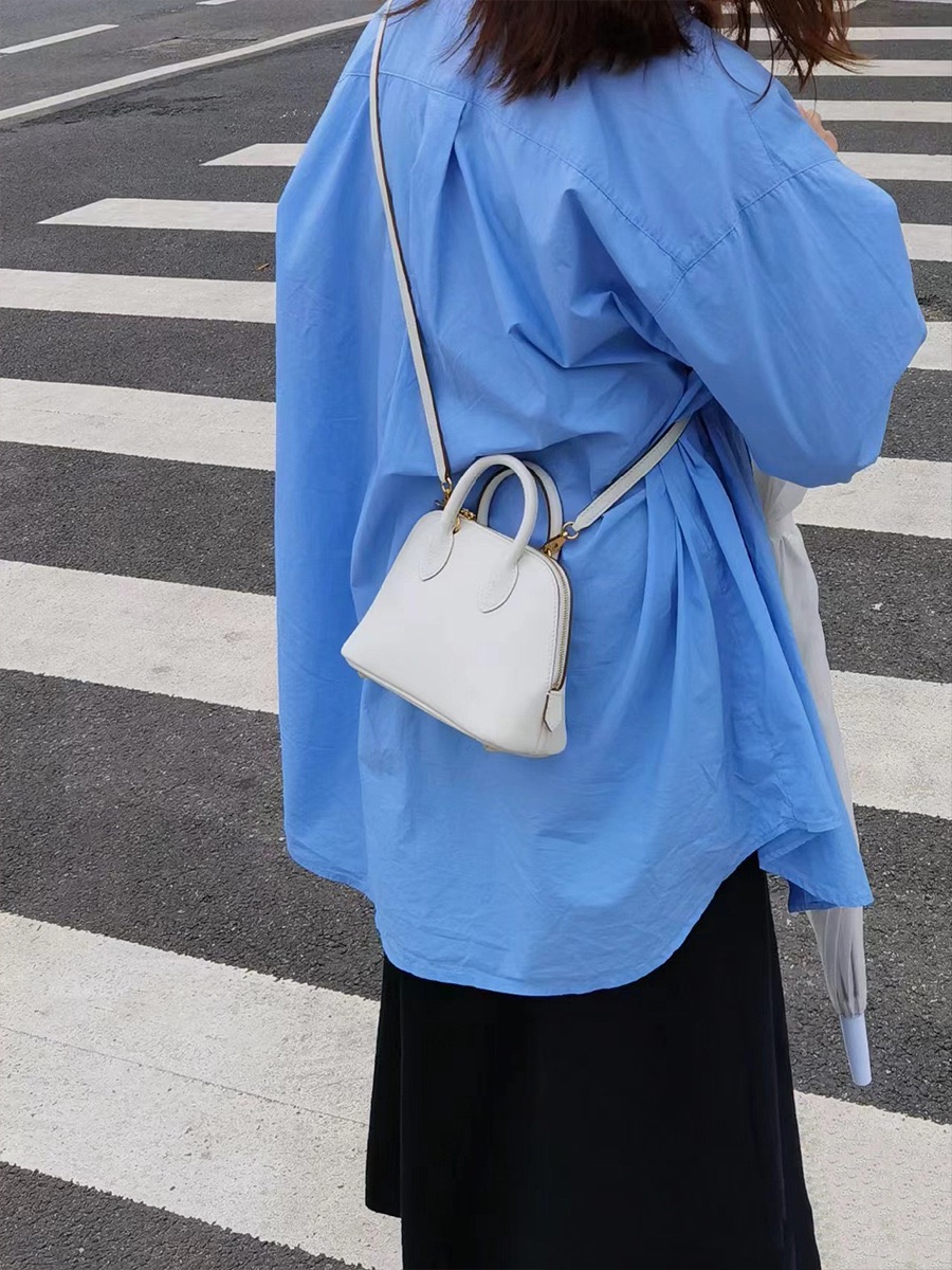 High-quality designer crossbody bag - handmade pure leather handbag. Small high-end bowling bag made of leather for women's crossbody bag.