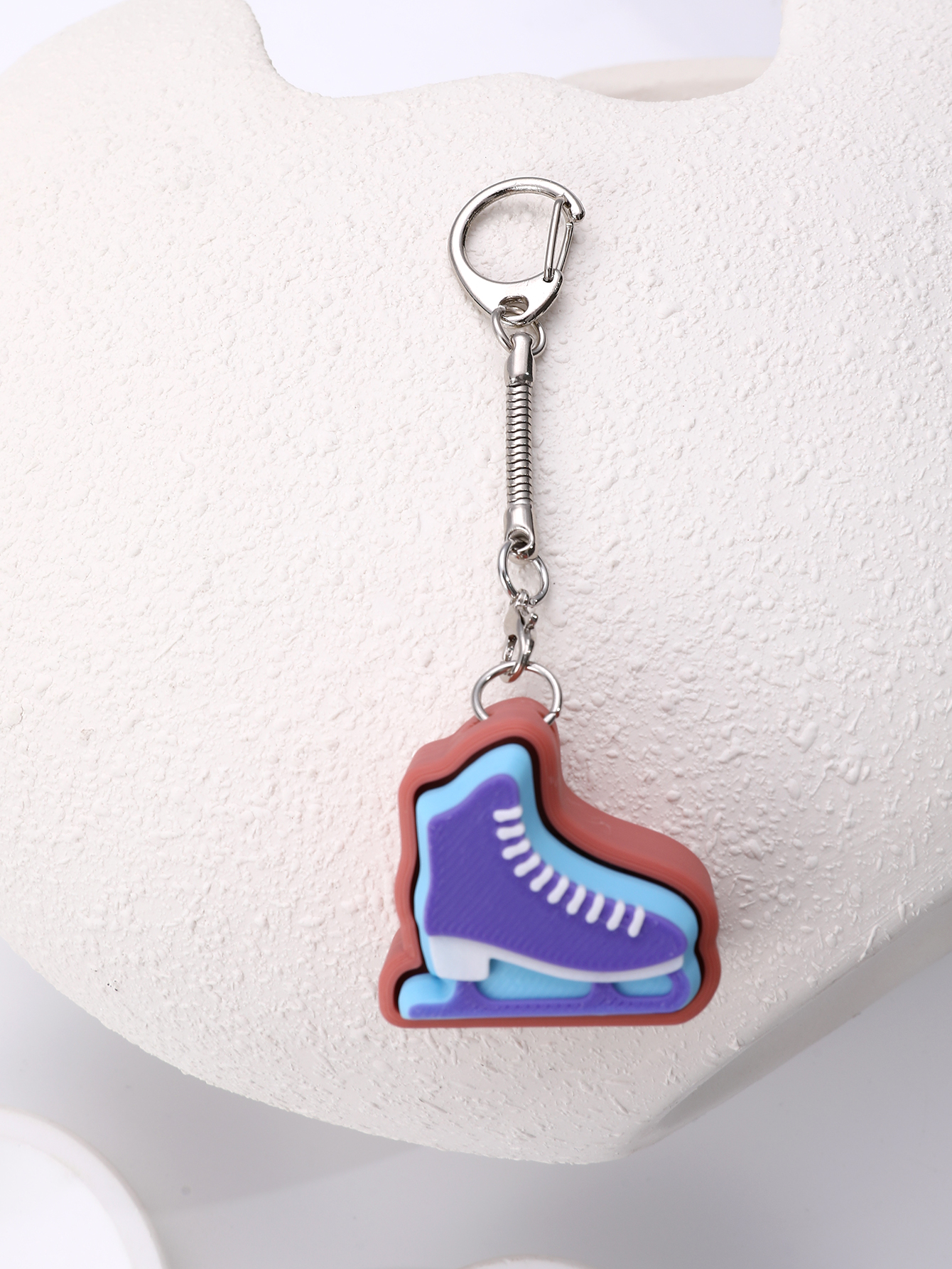 3D printed skating shoe-shaped keychain - an adult stress relief toy with a portable anxiety-reducing gadget featuring a clickable keyboard design