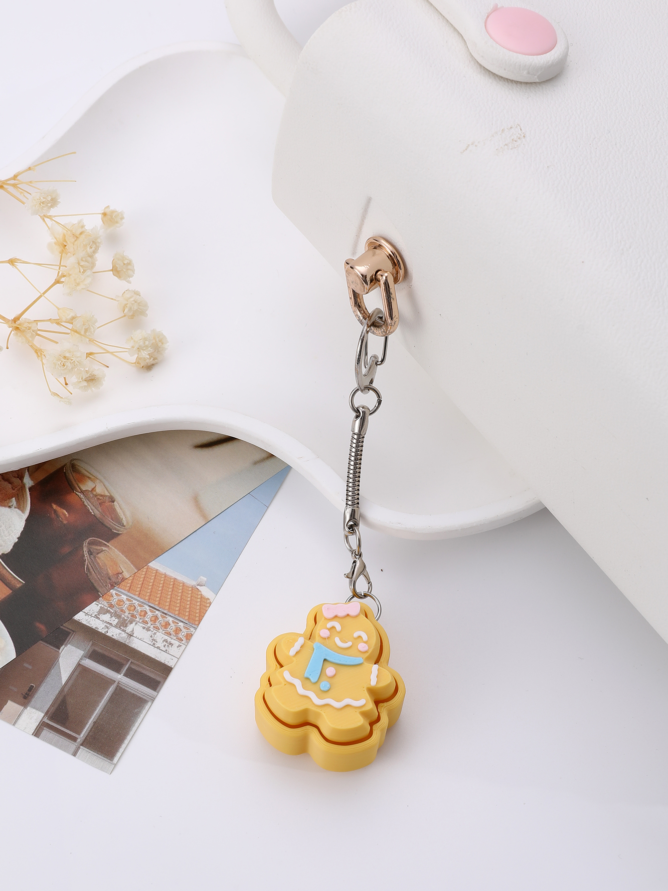 3D printed cookie-shaped keychain - an adult stress relief toy with a portable anxiety relief gadget featuring a clickable keyboard design