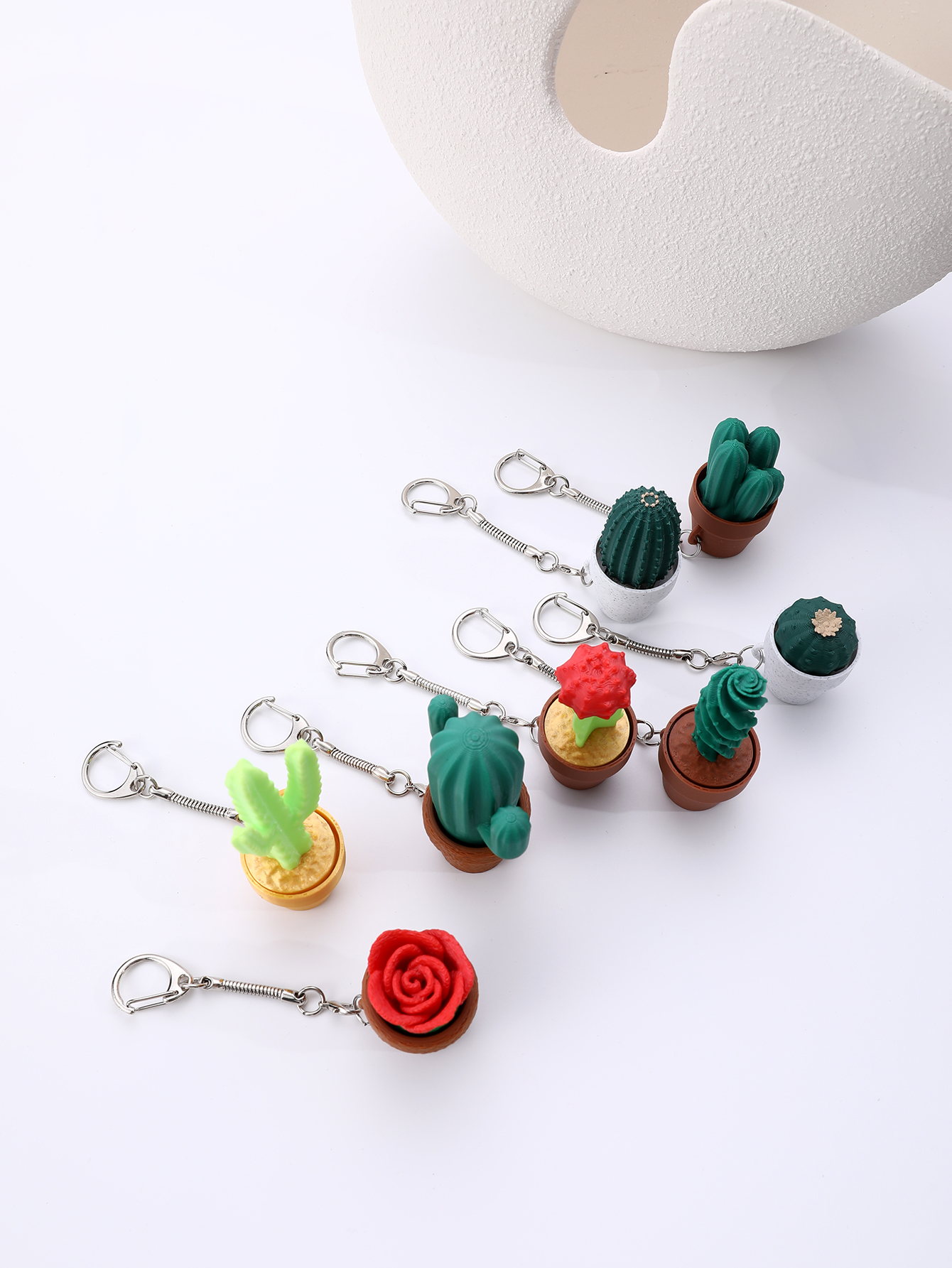 3D printed small potted plant hangers - adult stress relief toys, with a portable anxiety relief tool featuring a clickable keyboard design