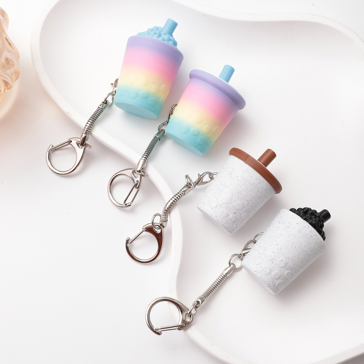 3D printed milk tea cup-shaped keychain - adult stress relief toy, with a portable anxiety relief gadget featuring a clickable keyboard design