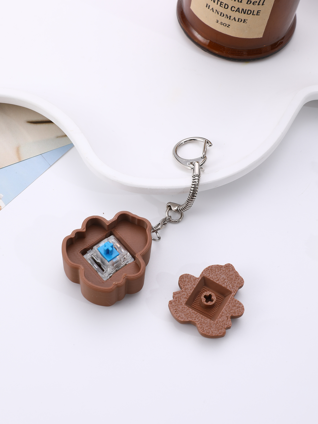 3D printed cookie-shaped keychain - an adult stress relief toy with a portable anxiety relief gadget featuring a clickable keyboard design