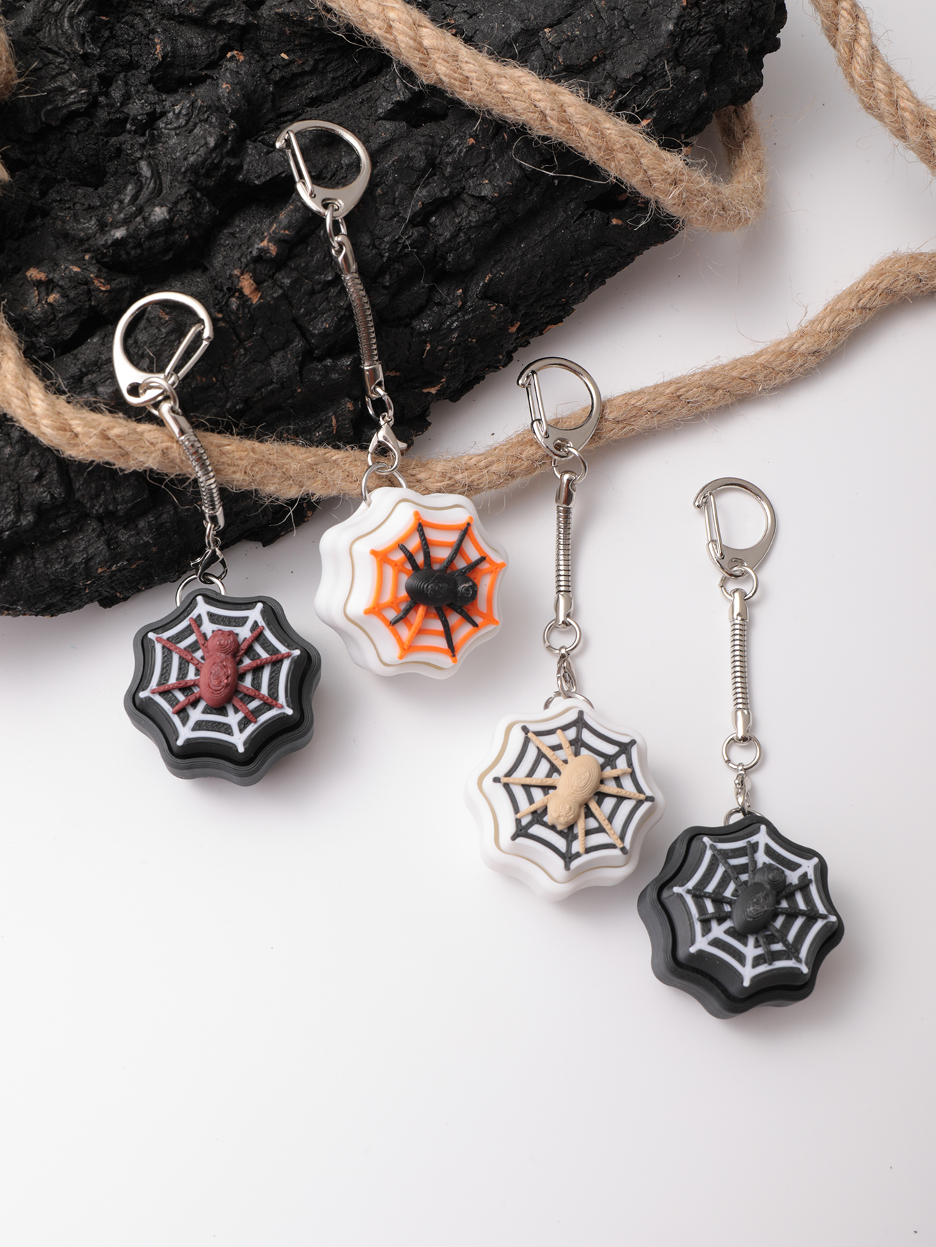 3D printed spider keychain - an adult stress relief toy with a portable anxiety-reducing gadget featuring a clickable keyboard design