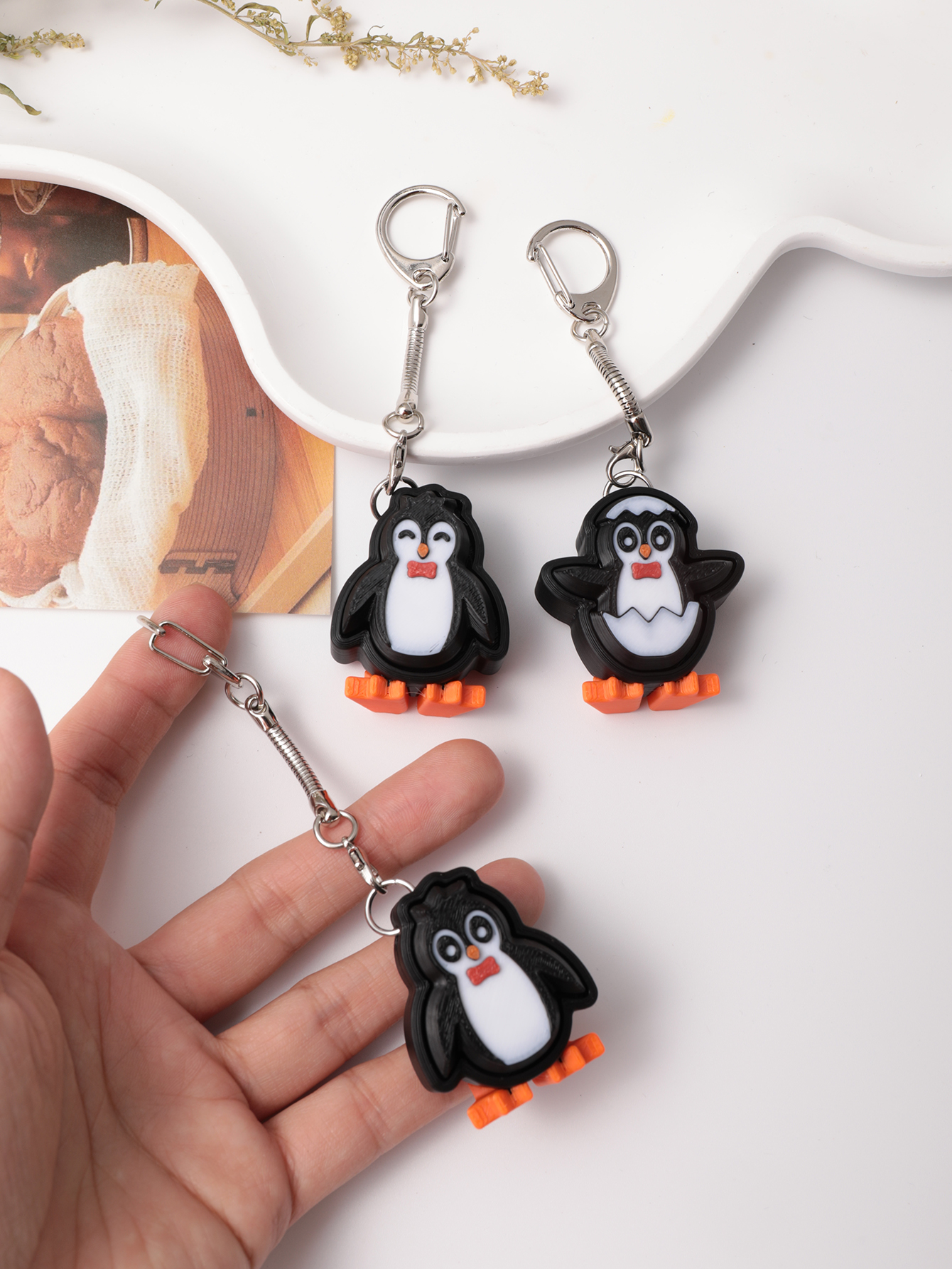 3D printed penguin keychain - an adult stress relief toy with a portable anxiety-reducing gadget featuring a clickable keyboard design
