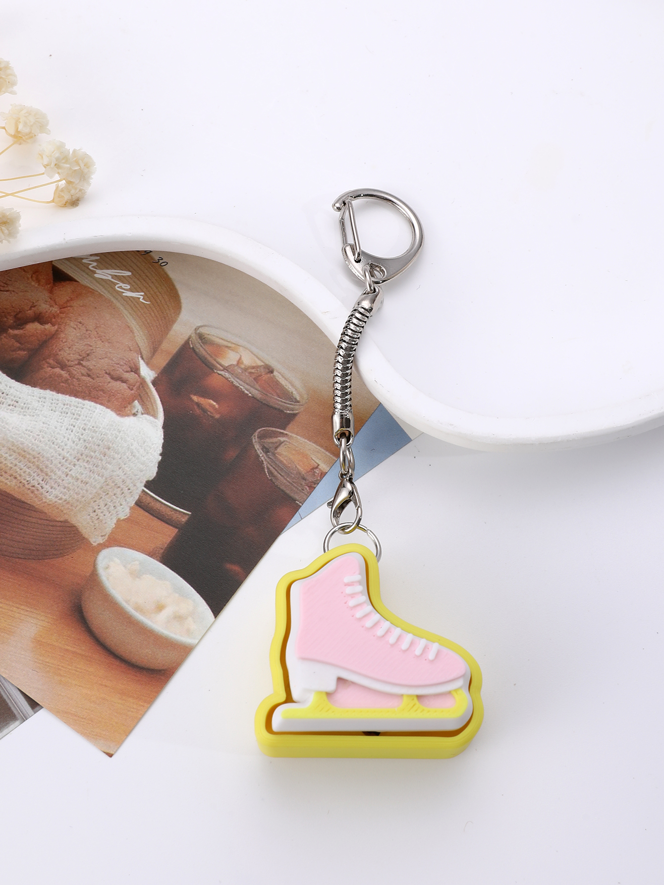 3D printed skating shoe-shaped keychain - an adult stress relief toy with a portable anxiety-reducing gadget featuring a clickable keyboard design