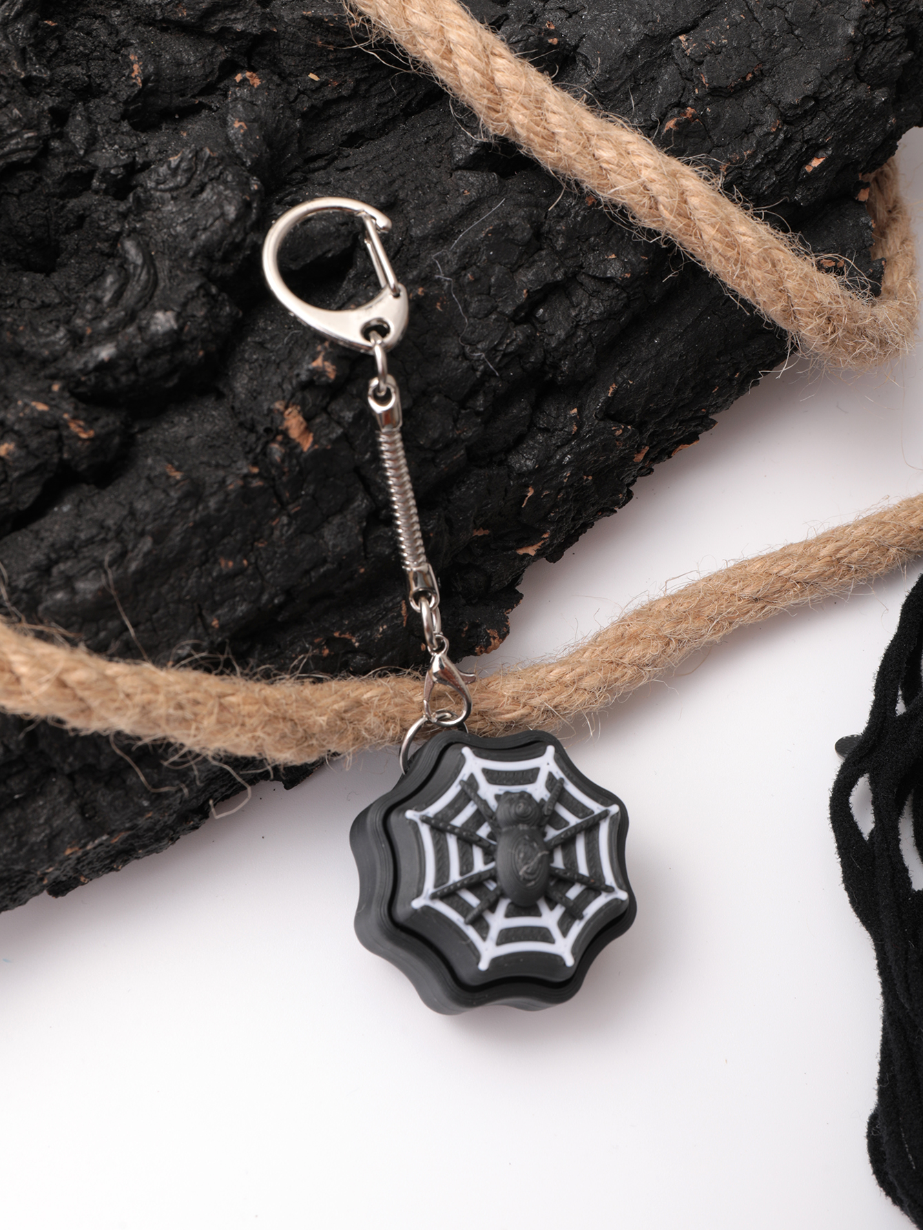 3D printed spider keychain - an adult stress relief toy with a portable anxiety-reducing gadget featuring a clickable keyboard design