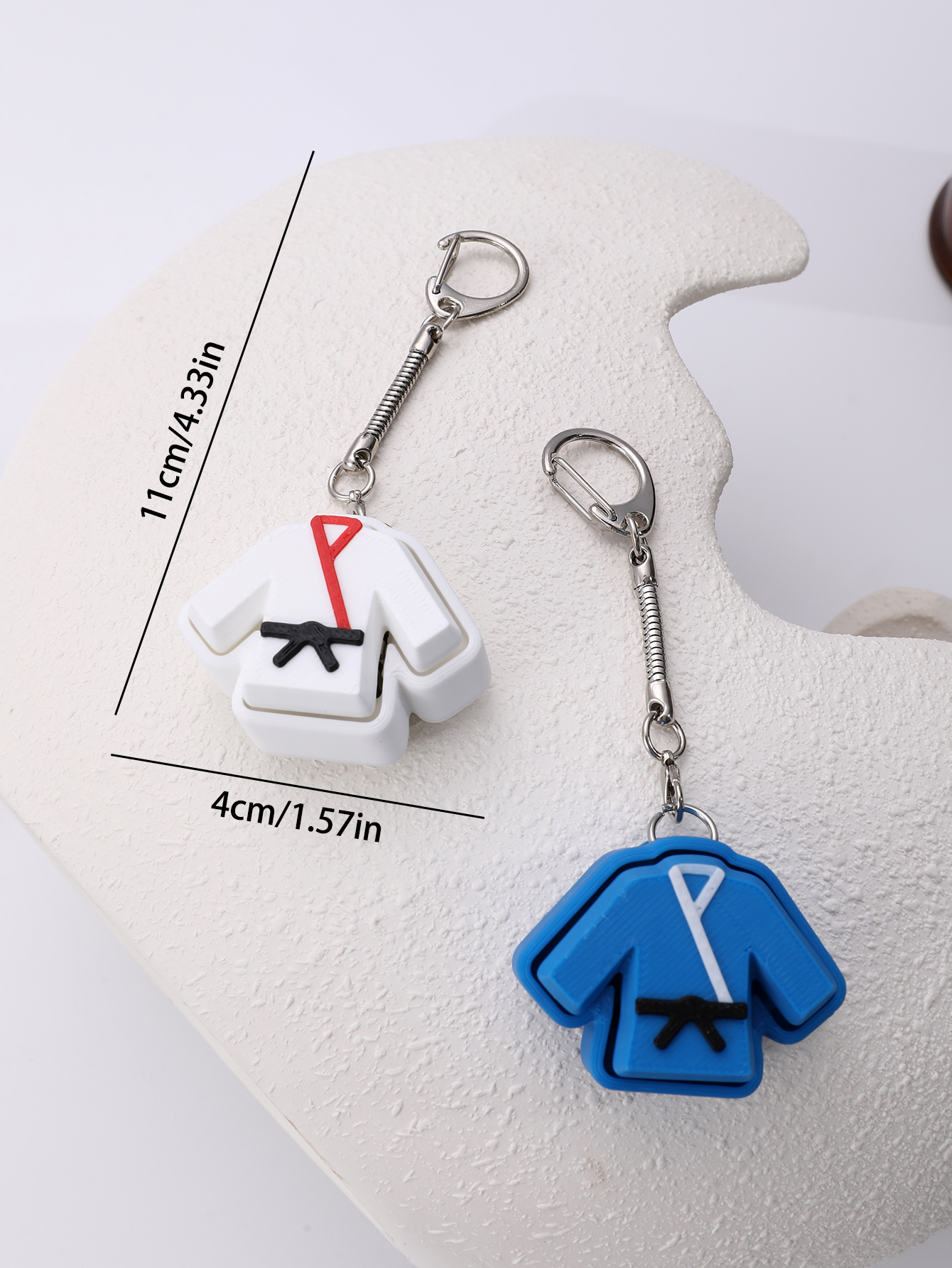 3D printed taekwondo uniform keychain - an adult stress relief toy with a portable anxiety-reducing gadget featuring a clickable keyboard design