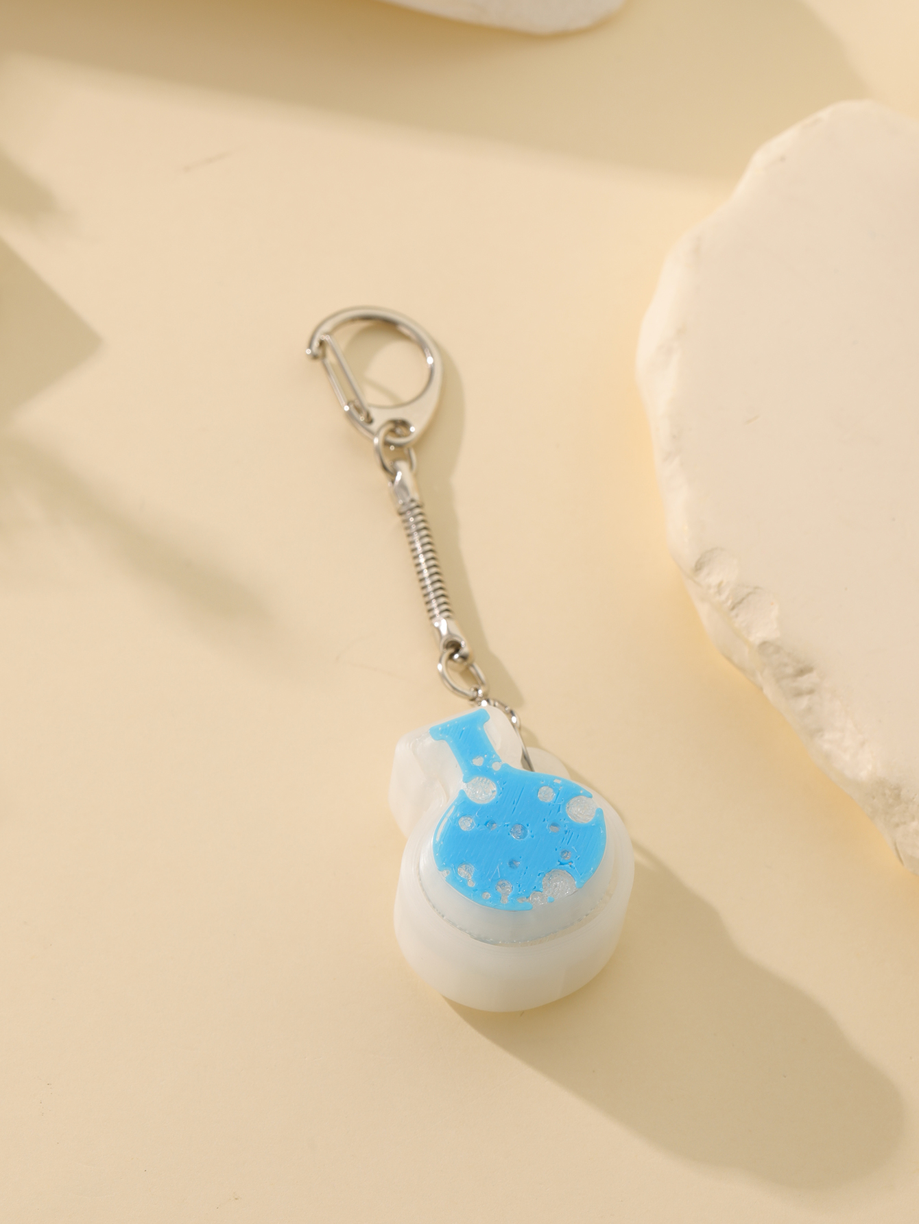 3D printed magic potion bottle pendant - an adult stress relief toy with a portable anxiety relief gadget featuring a clickable keyboard design