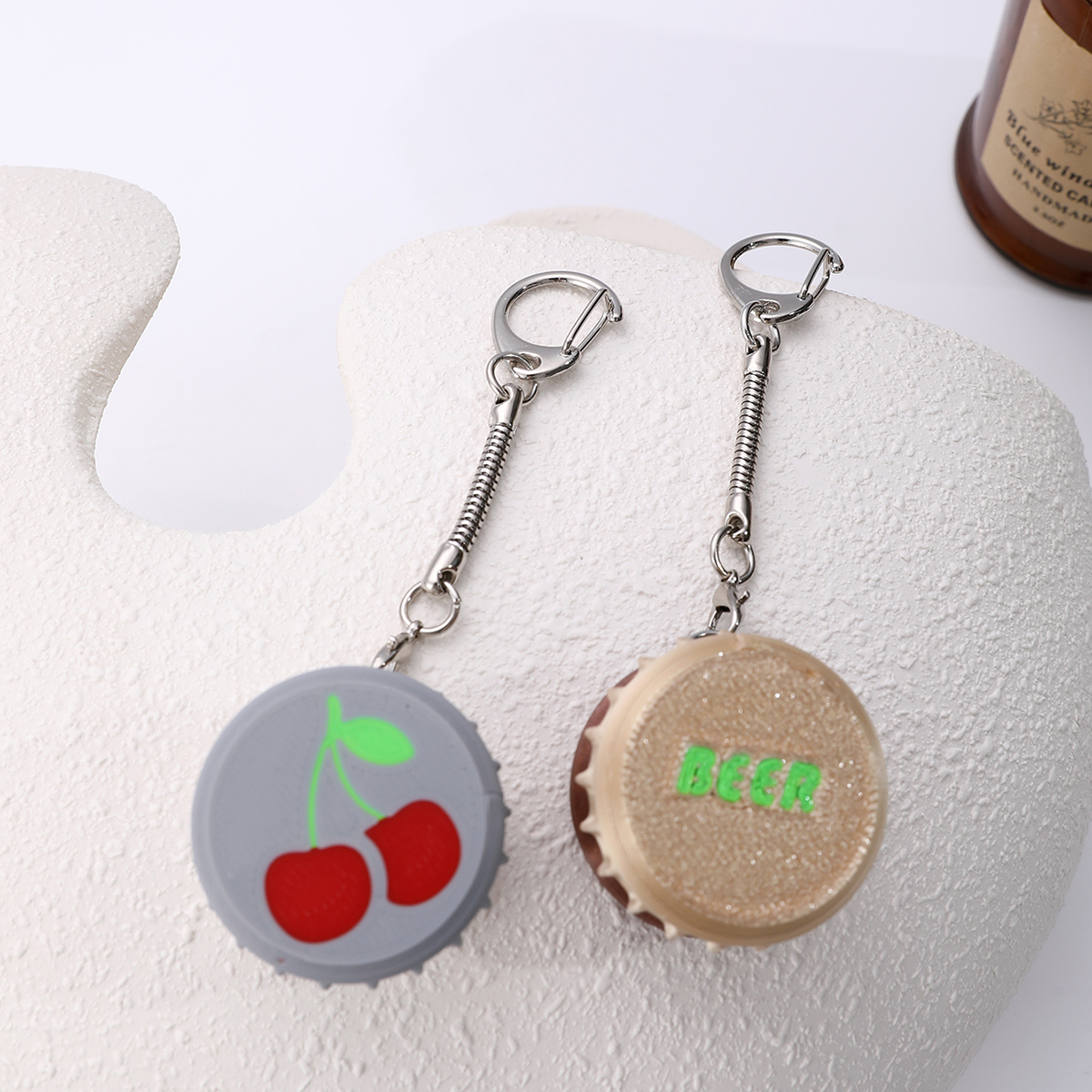 3D printed wine bottle cap keychain - adult stress relief toy, with a portable anxiety relief gadget featuring a clickable keyboard design