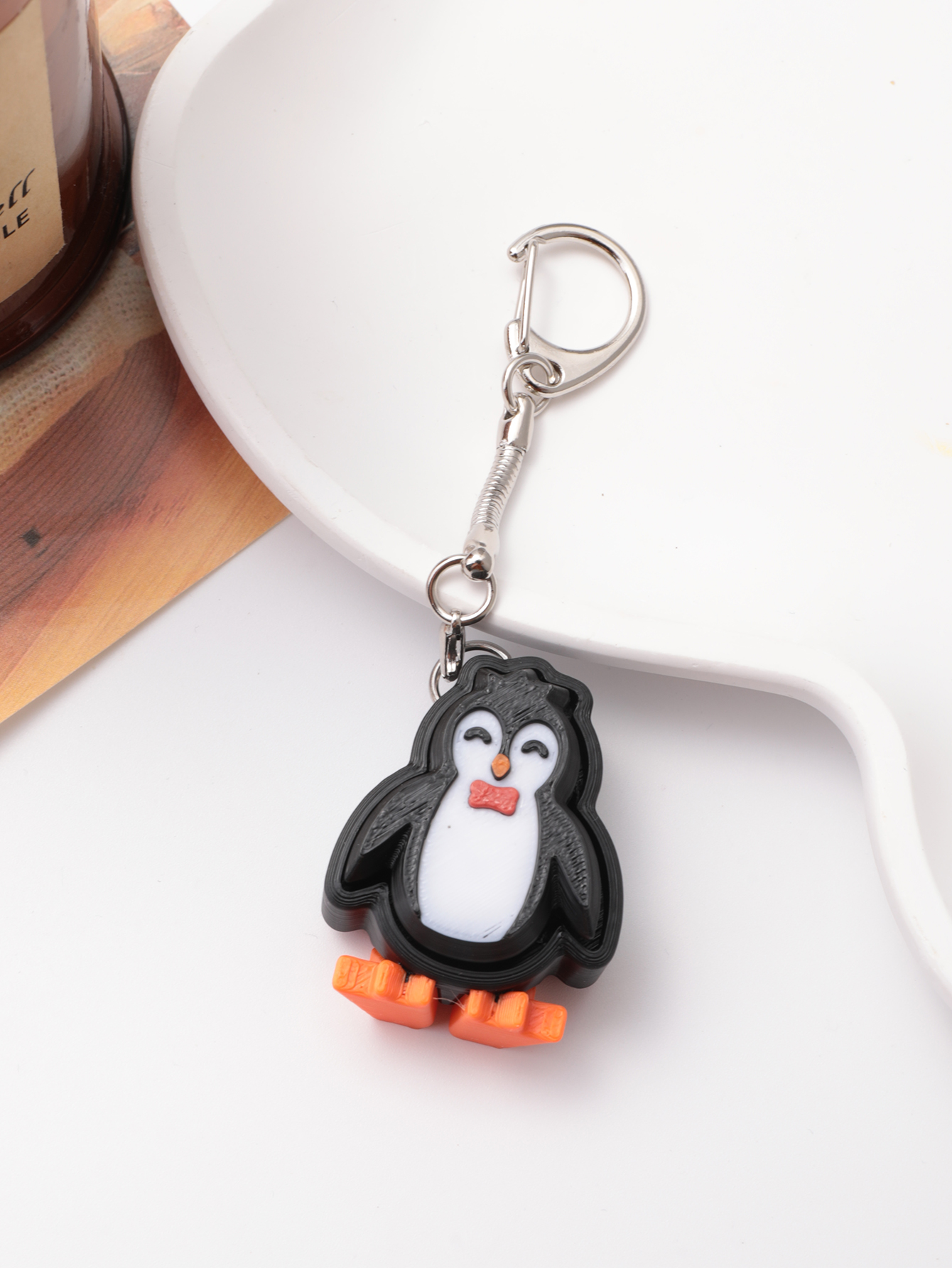 3D printed penguin keychain - an adult stress relief toy with a portable anxiety-reducing gadget featuring a clickable keyboard design