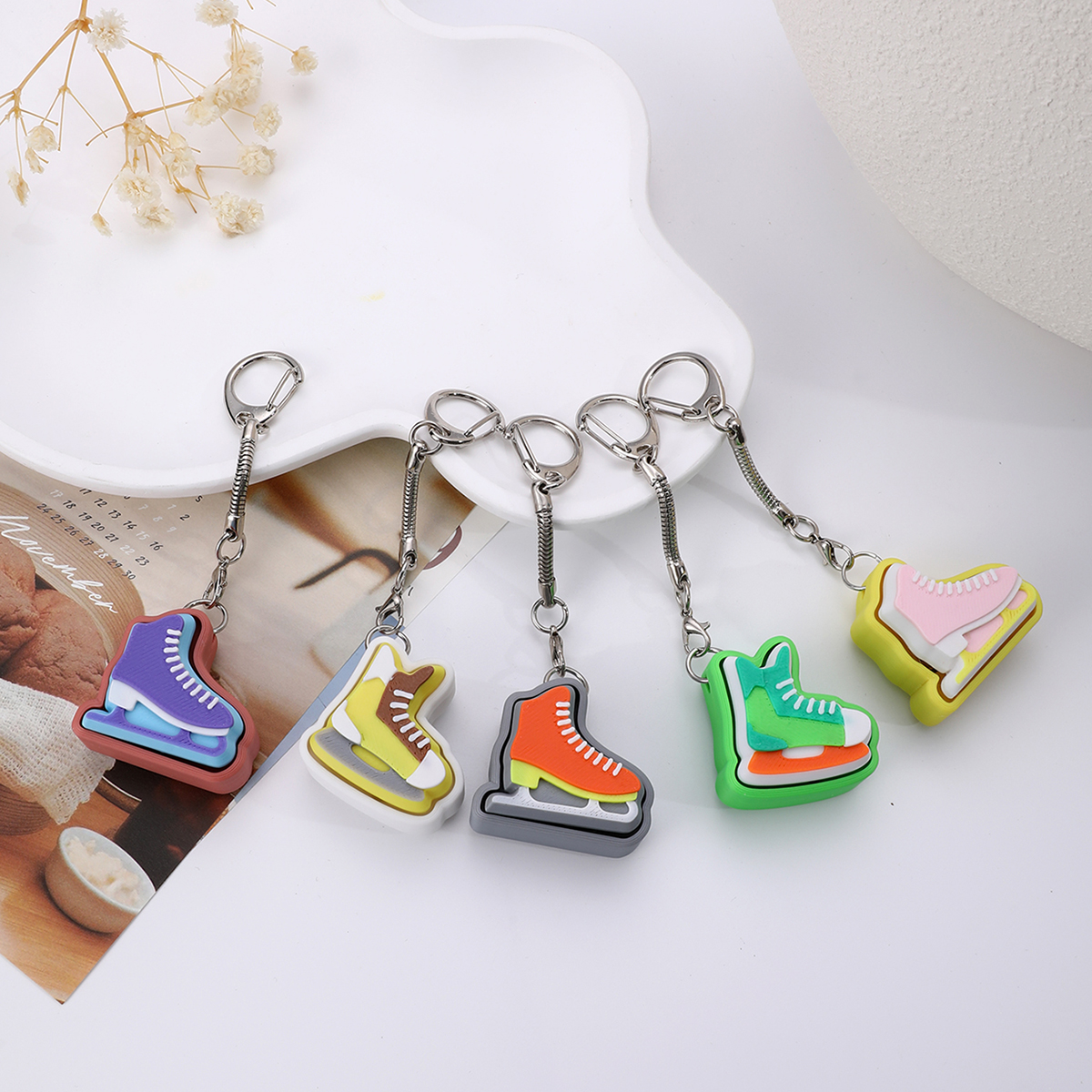 3D printed skating shoe-shaped keychain - an adult stress relief toy with a portable anxiety-reducing gadget featuring a clickable keyboard design