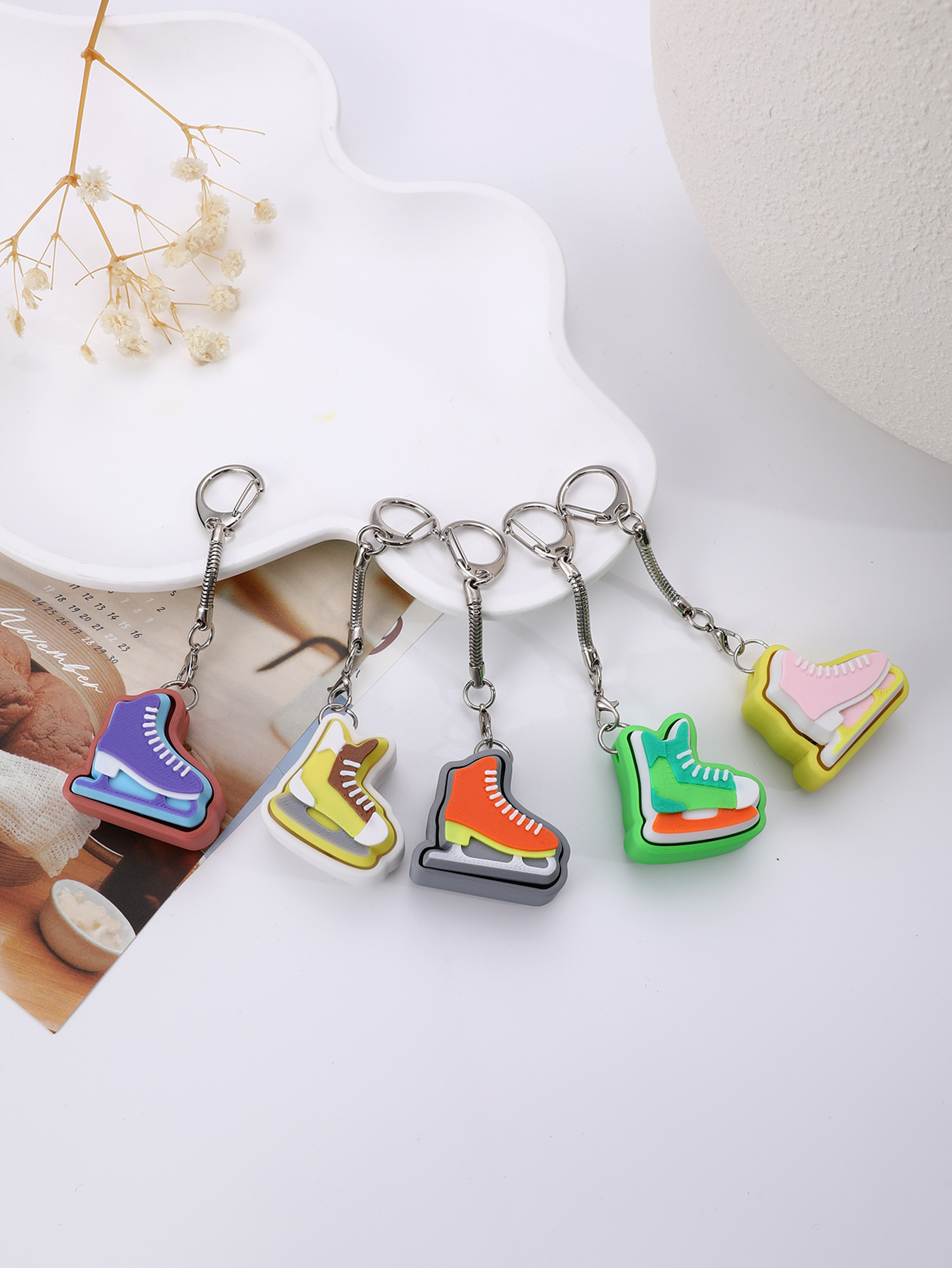 3D printed skating shoe-shaped keychain - an adult stress relief toy with a portable anxiety-reducing gadget featuring a clickable keyboard design