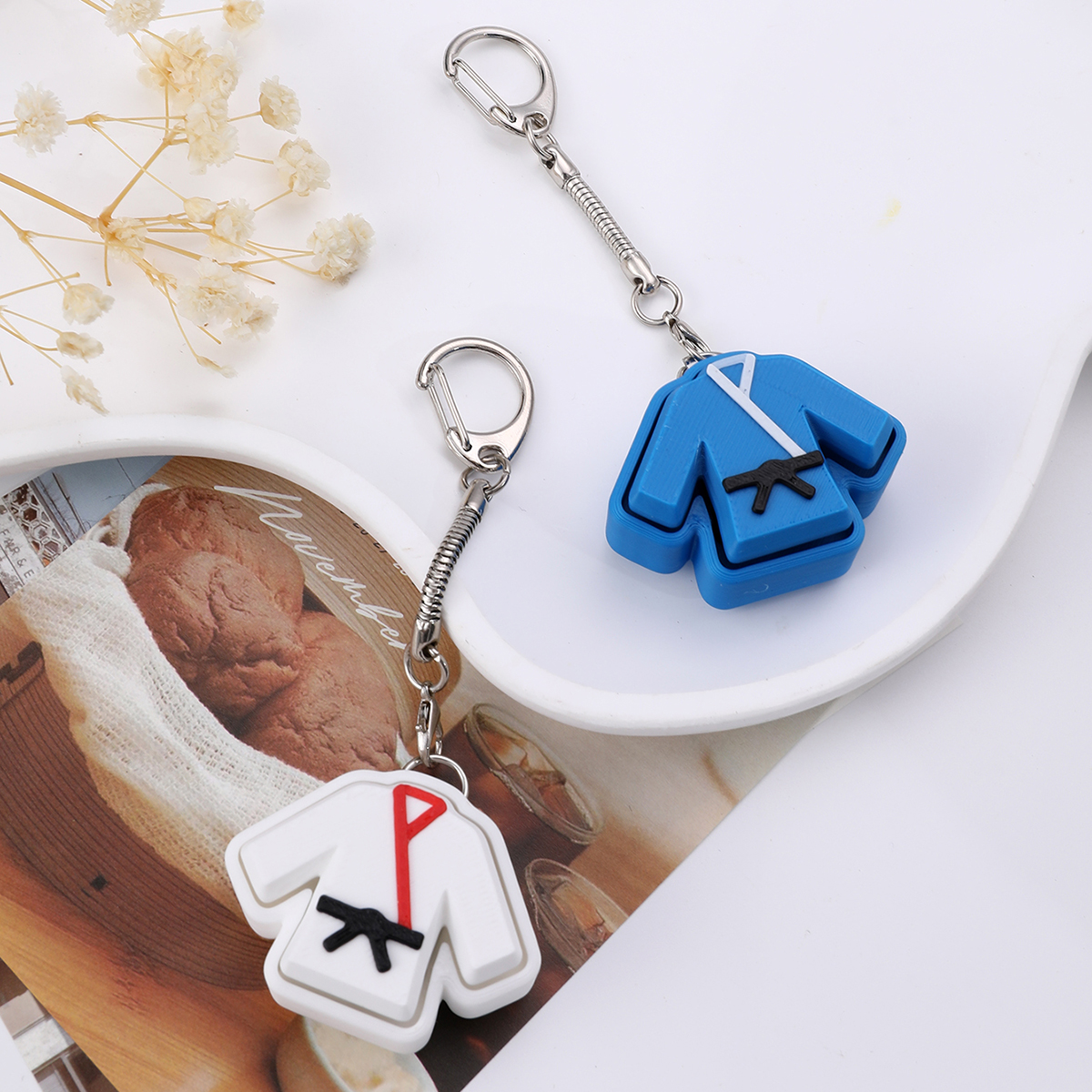 3D printed taekwondo uniform keychain - an adult stress relief toy with a portable anxiety-reducing gadget featuring a clickable keyboard design