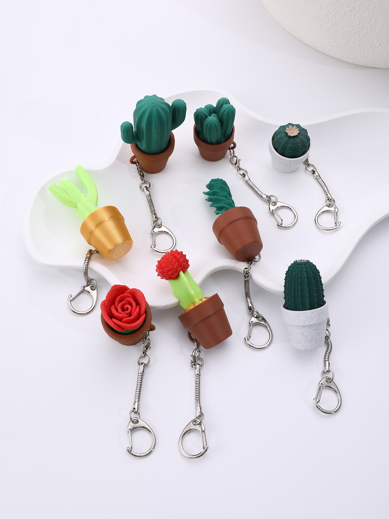 3D printed small potted plant hangers - adult stress relief toys, with a portable anxiety relief tool featuring a clickable keyboard design