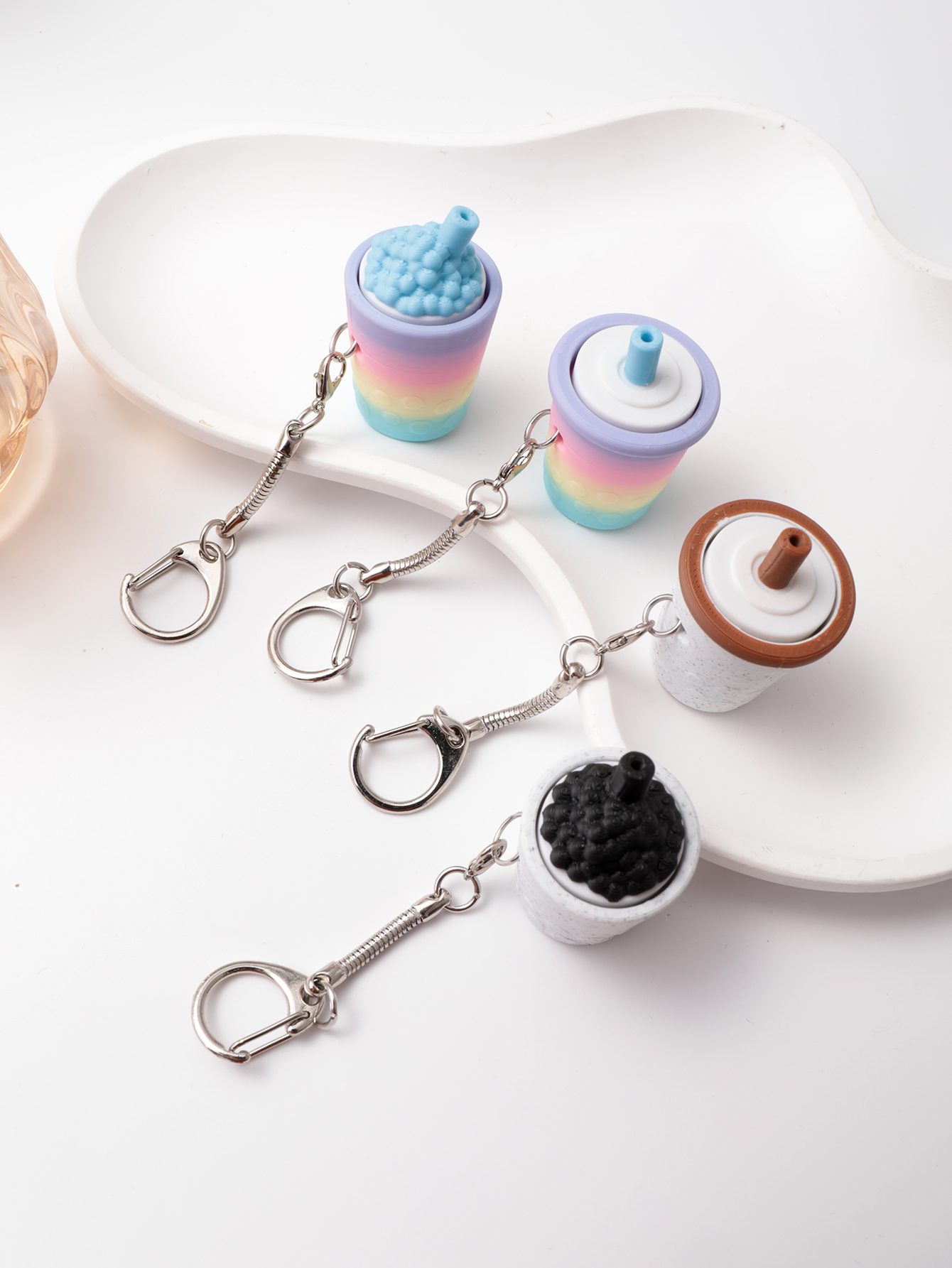 3D printed milk tea cup-shaped keychain - adult stress relief toy, with a portable anxiety relief gadget featuring a clickable keyboard design