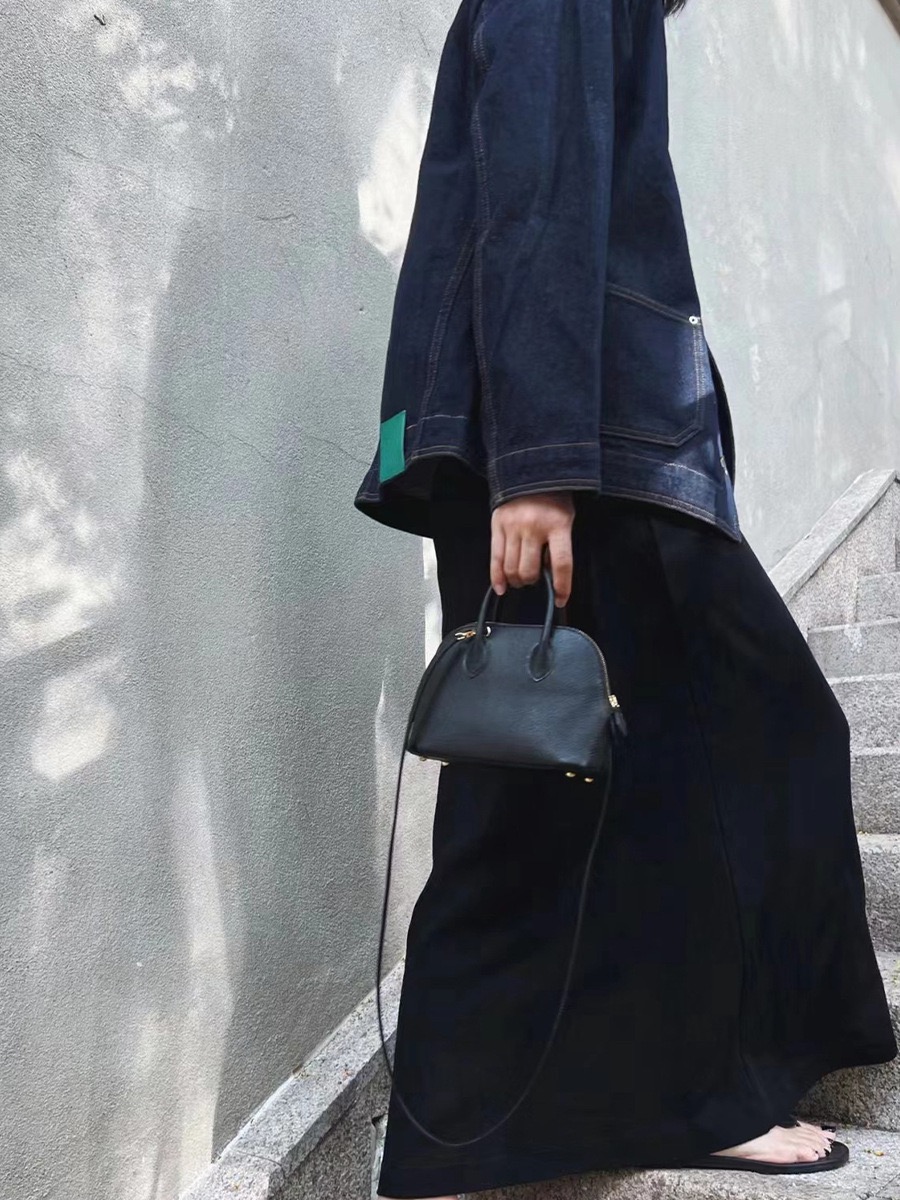 High-quality designer crossbody bag - handmade pure leather handbag. Small high-end bowling bag made of leather for women's crossbody bag.