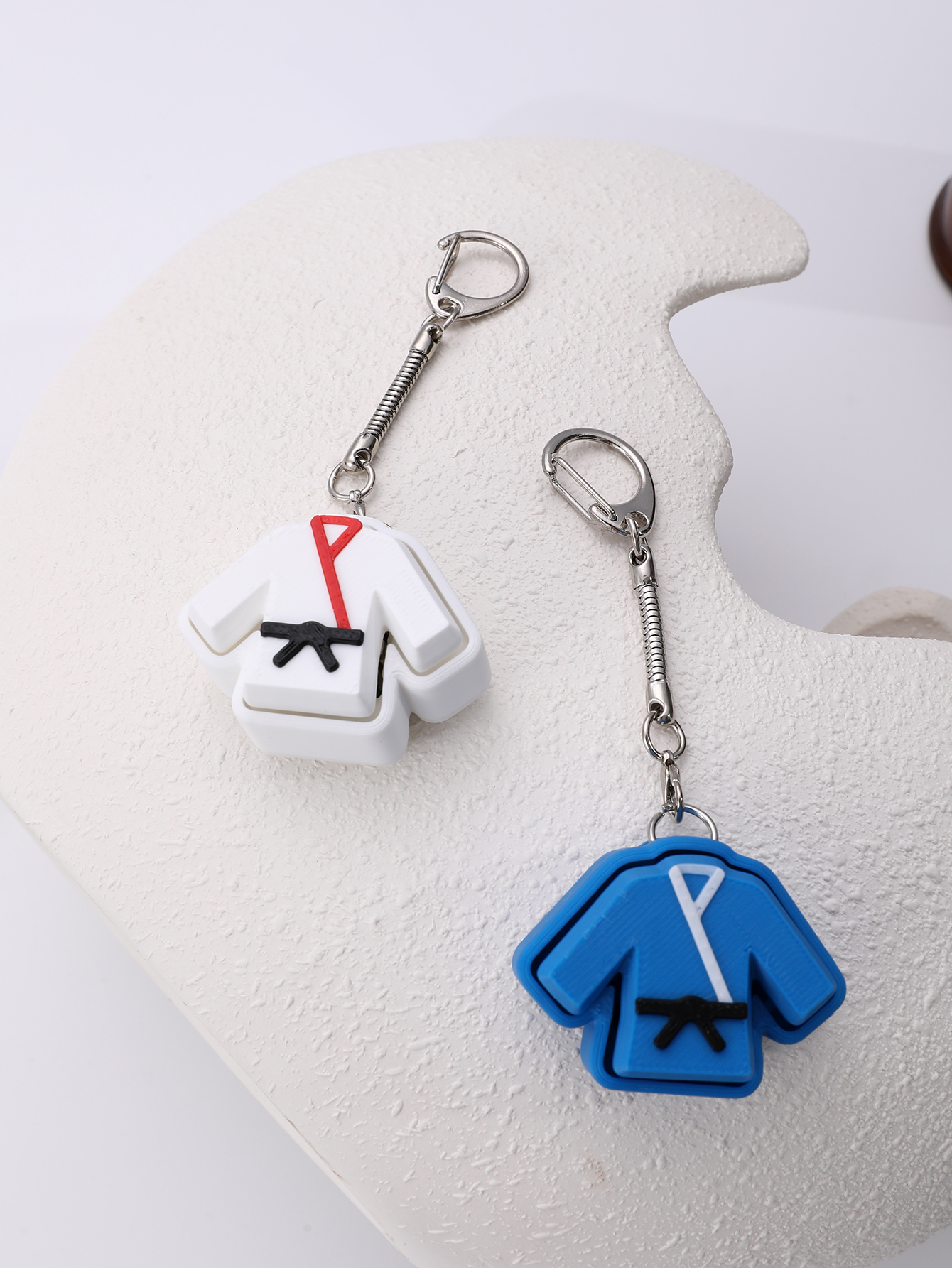3D printed taekwondo uniform keychain - an adult stress relief toy with a portable anxiety-reducing gadget featuring a clickable keyboard design