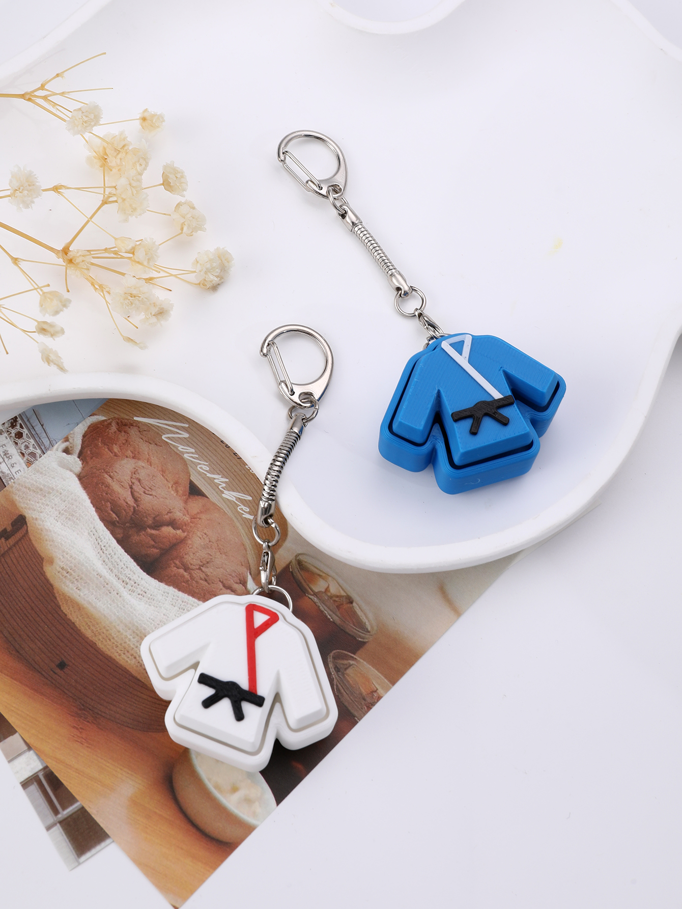 3D printed taekwondo uniform keychain - an adult stress relief toy with a portable anxiety-reducing gadget featuring a clickable keyboard design