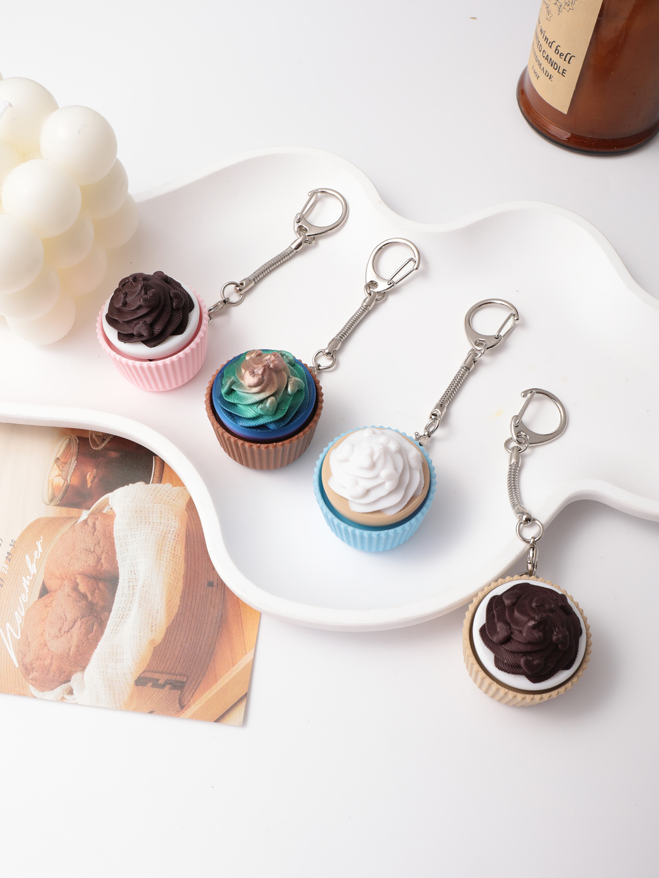 3D printed cupcake-shaped keychain - an adult stress relief toy with a portable anxiety-reducing gadget featuring a clickable keyboard design