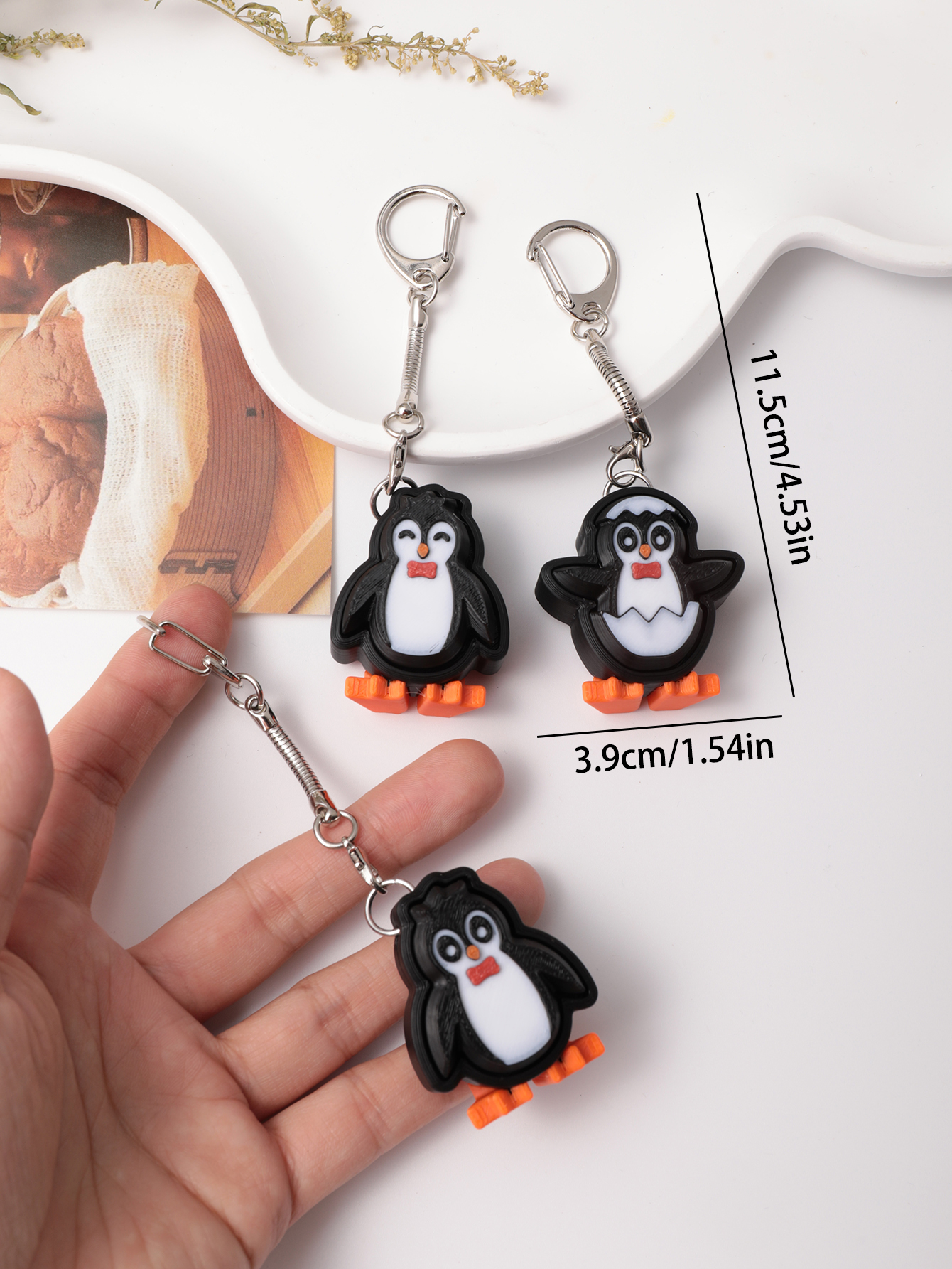 3D printed penguin keychain - an adult stress relief toy with a portable anxiety-reducing gadget featuring a clickable keyboard design