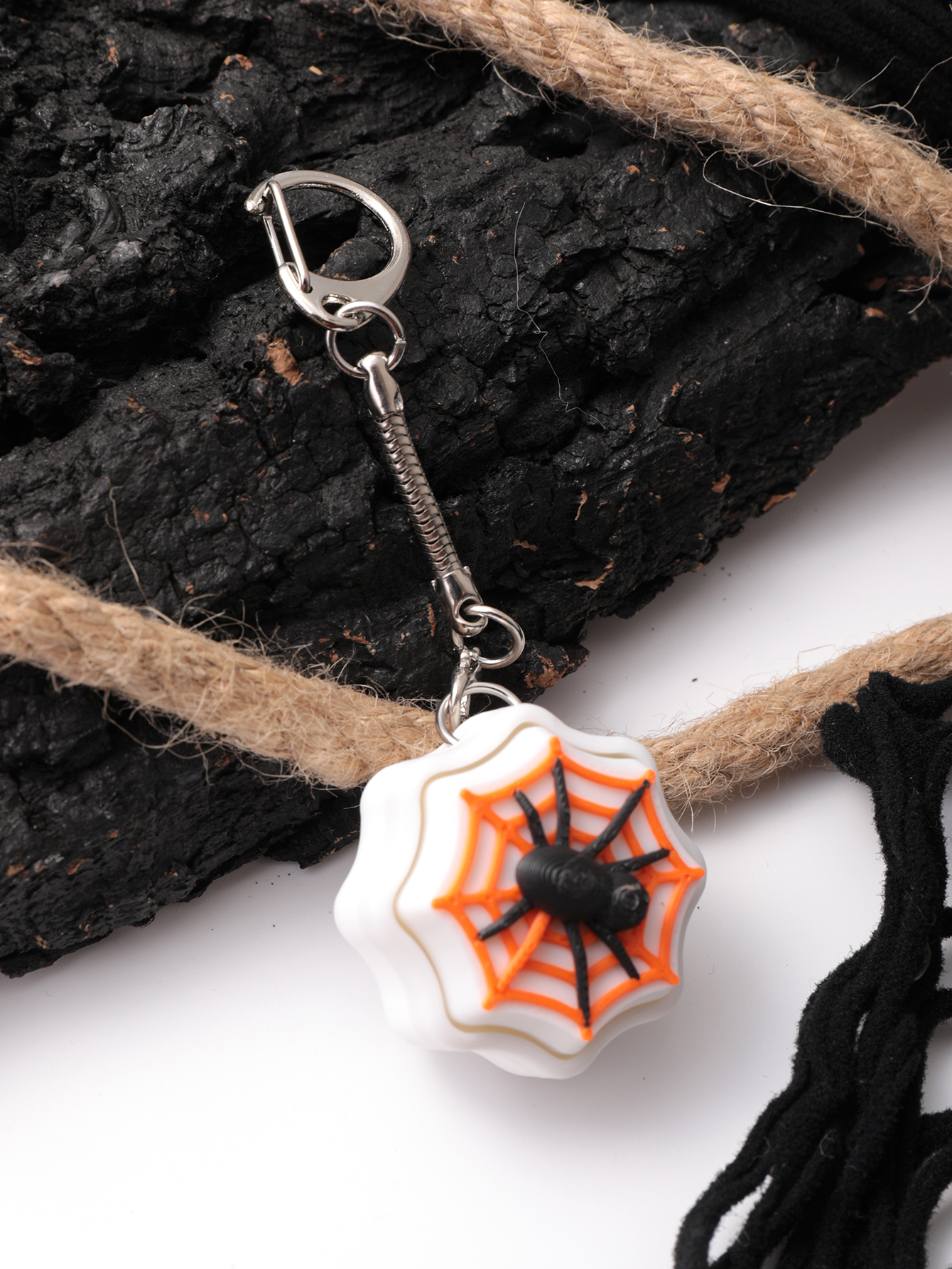 3D printed spider keychain - an adult stress relief toy with a portable anxiety-reducing gadget featuring a clickable keyboard design