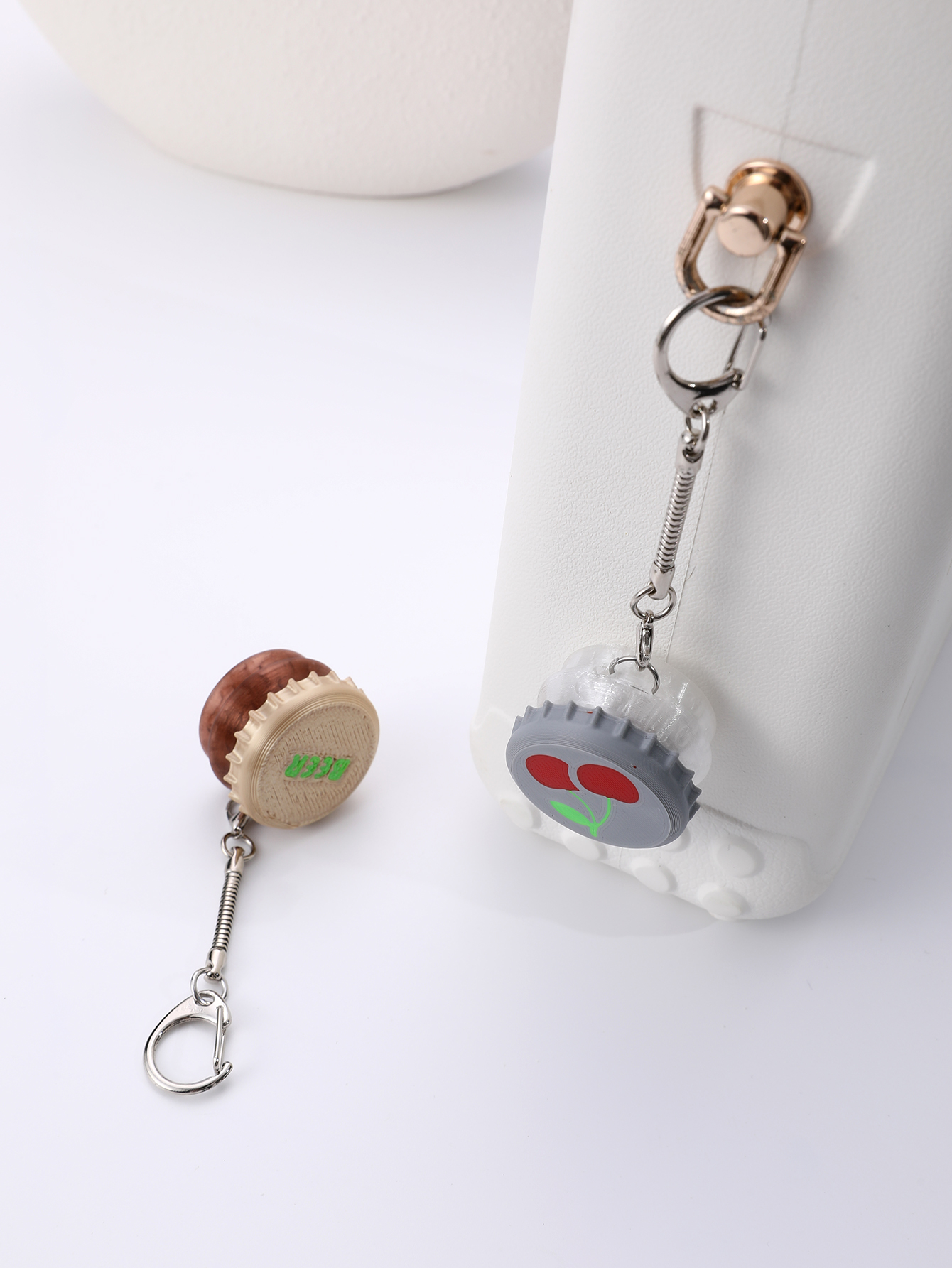 3D printed wine bottle cap keychain - adult stress relief toy, with a portable anxiety relief gadget featuring a clickable keyboard design