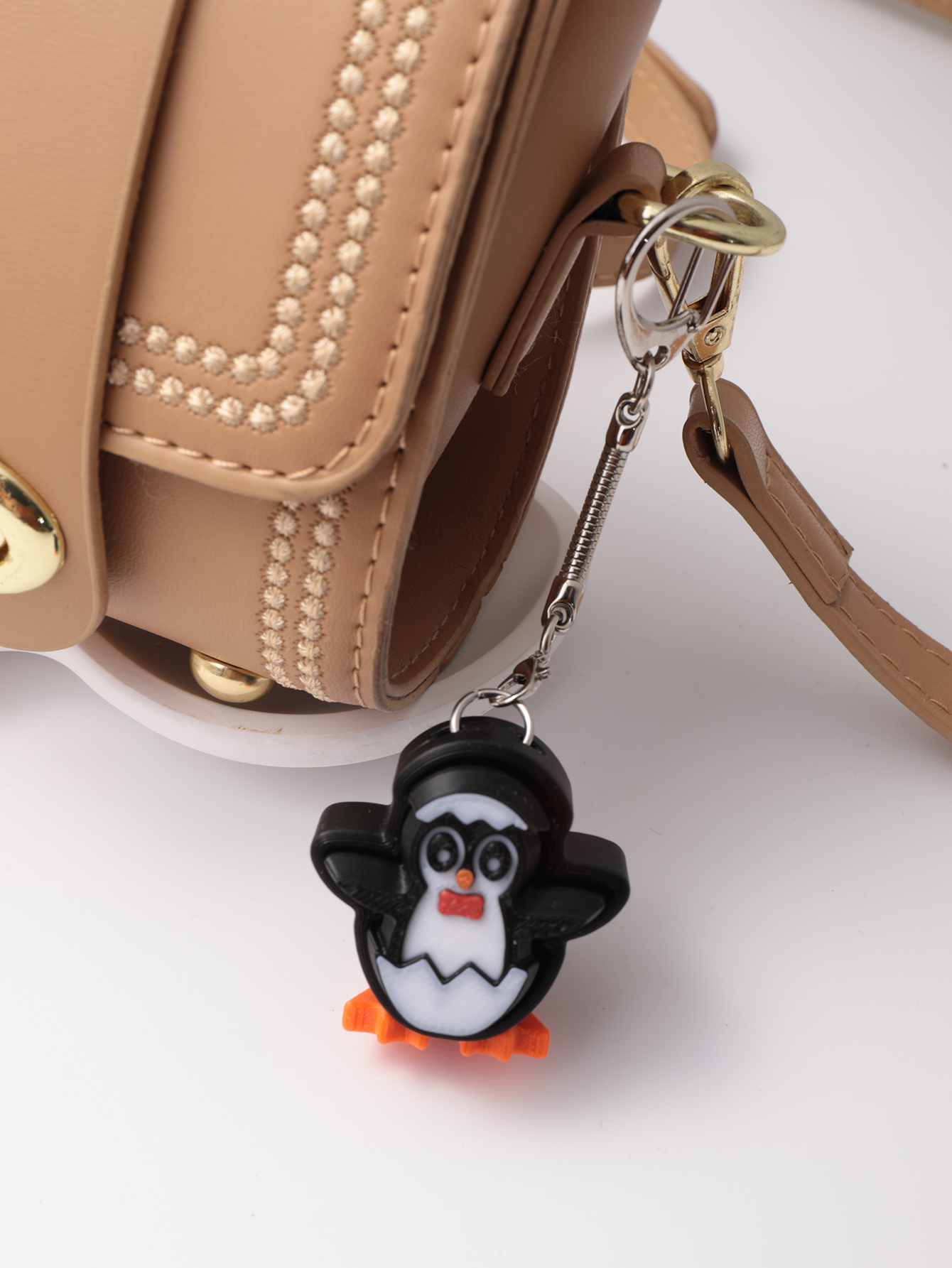 3D printed penguin keychain - an adult stress relief toy with a portable anxiety-reducing gadget featuring a clickable keyboard design