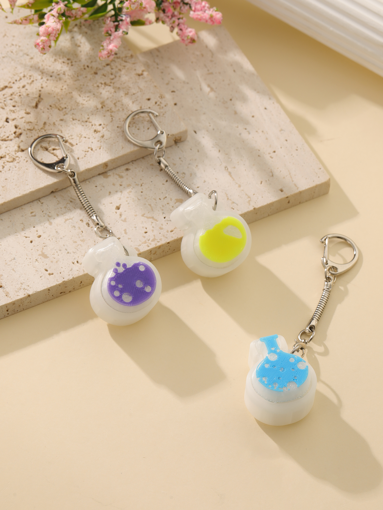 3D printed magic potion bottle pendant - an adult stress relief toy with a portable anxiety relief gadget featuring a clickable keyboard design